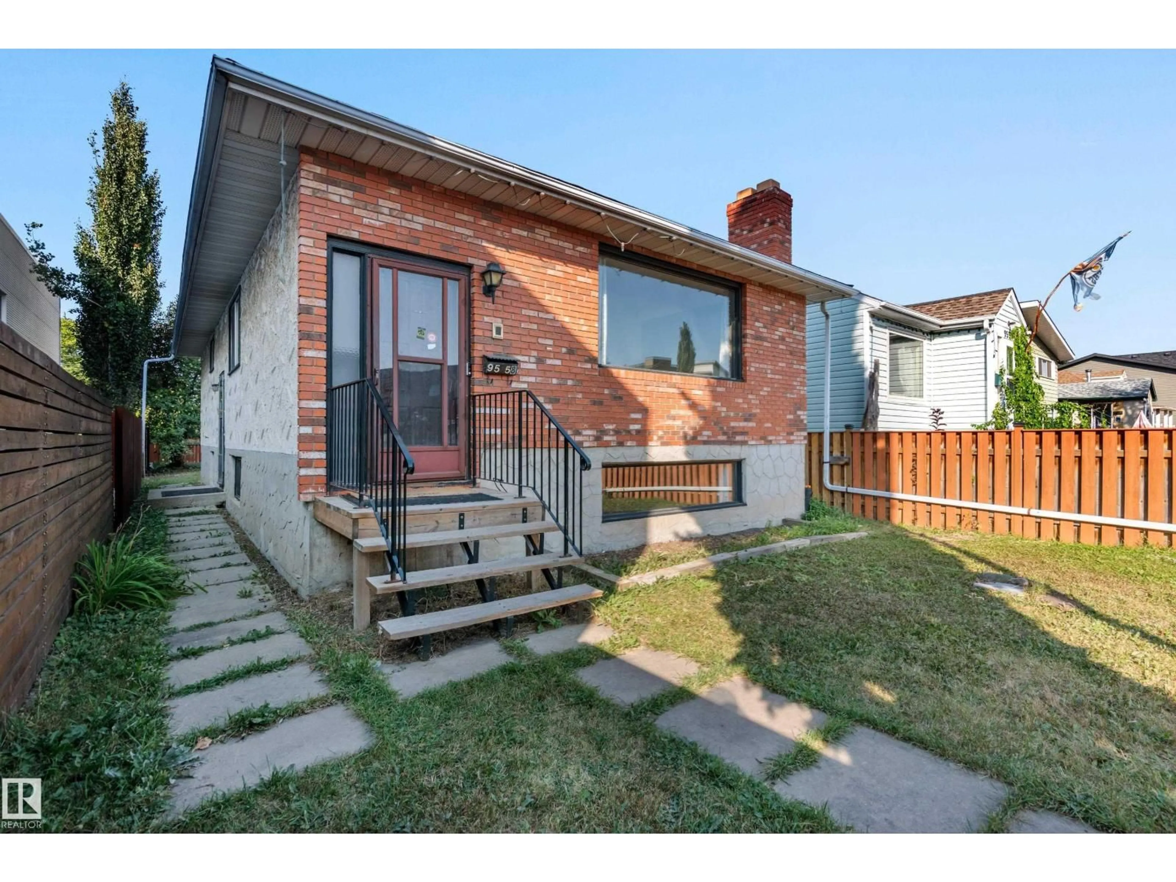 Home with brick exterior material, street for 9558 76 AV, Edmonton Alberta T6C0K2