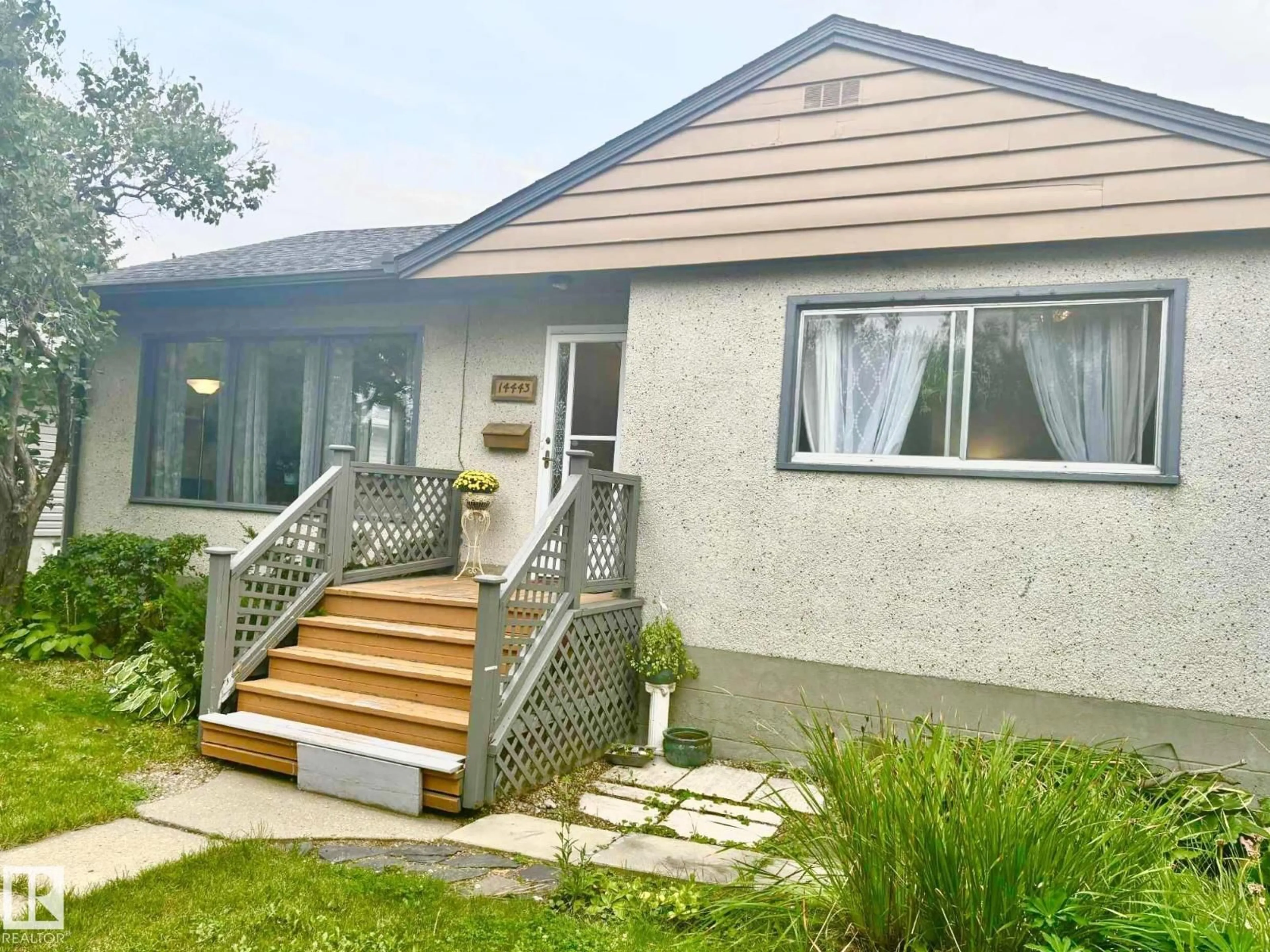 Home with vinyl exterior material, street for 14443 107A AV, Edmonton Alberta T5N1G3