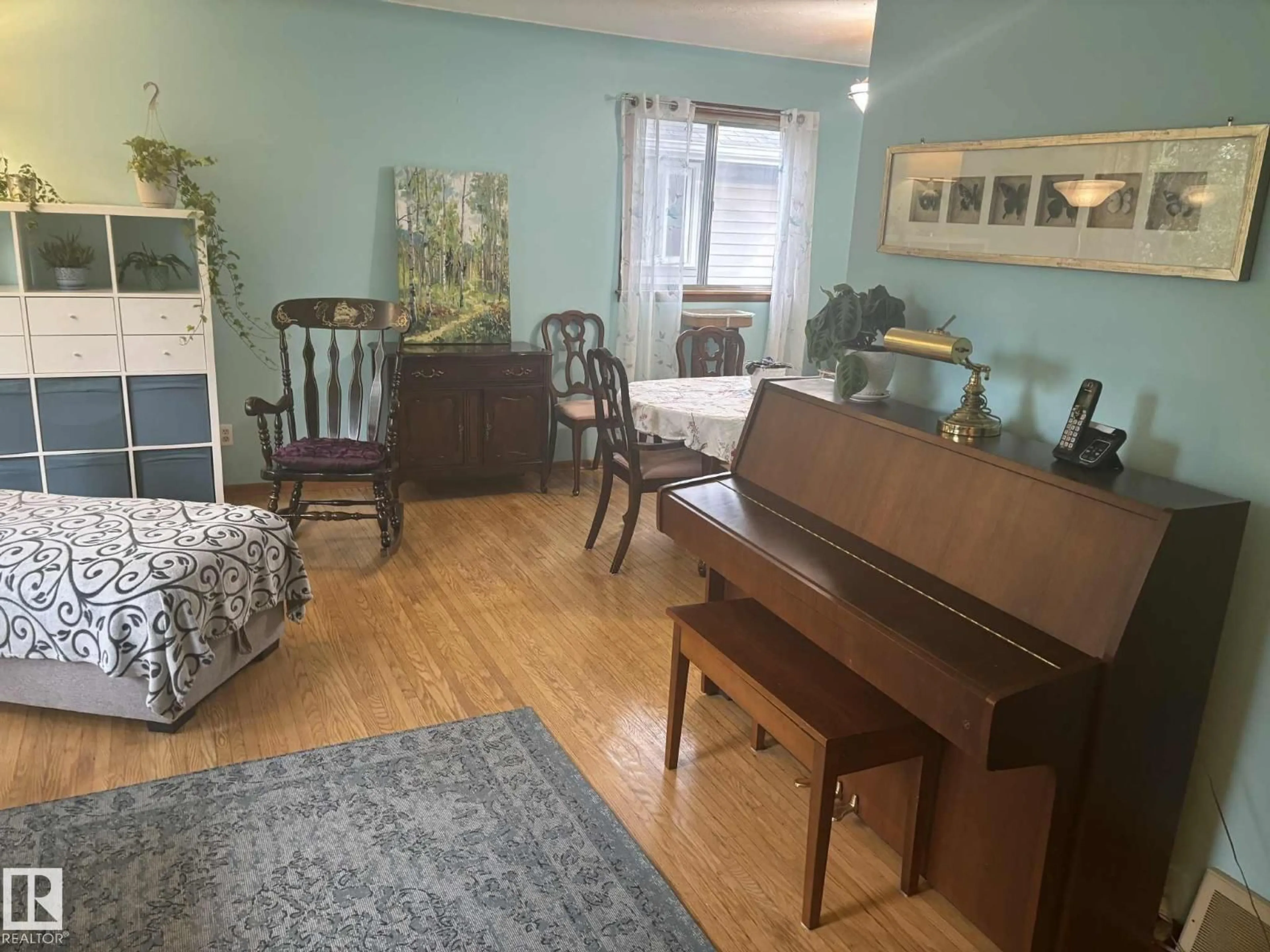 Living room with furniture, wood/laminate floor for 14443 107A AV, Edmonton Alberta T5N1G3
