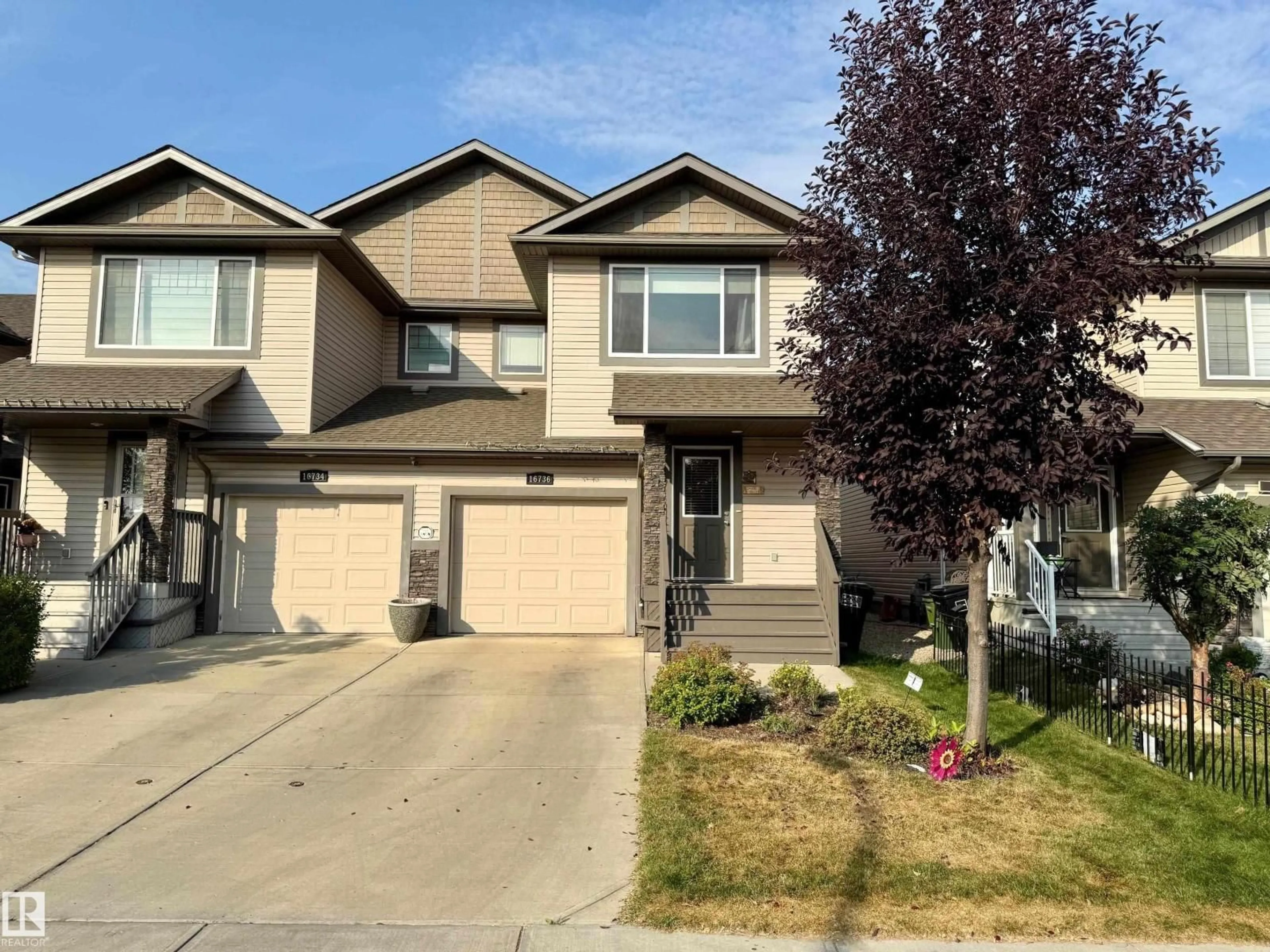Home with vinyl exterior material, street for NW - 16736 53 ST, Edmonton Alberta T5Y0R6