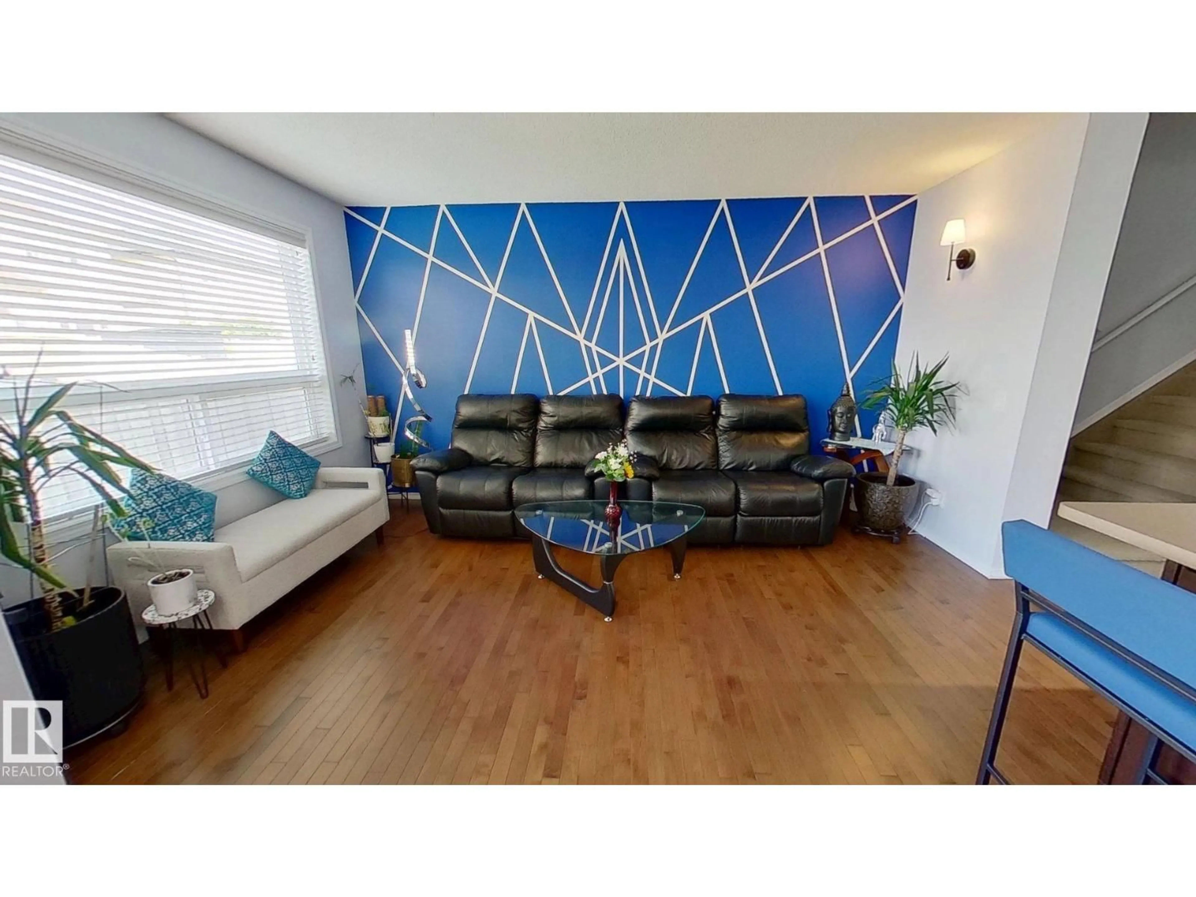 Living room with furniture, wood/laminate floor for NW - 16736 53 ST, Edmonton Alberta T5Y0R6