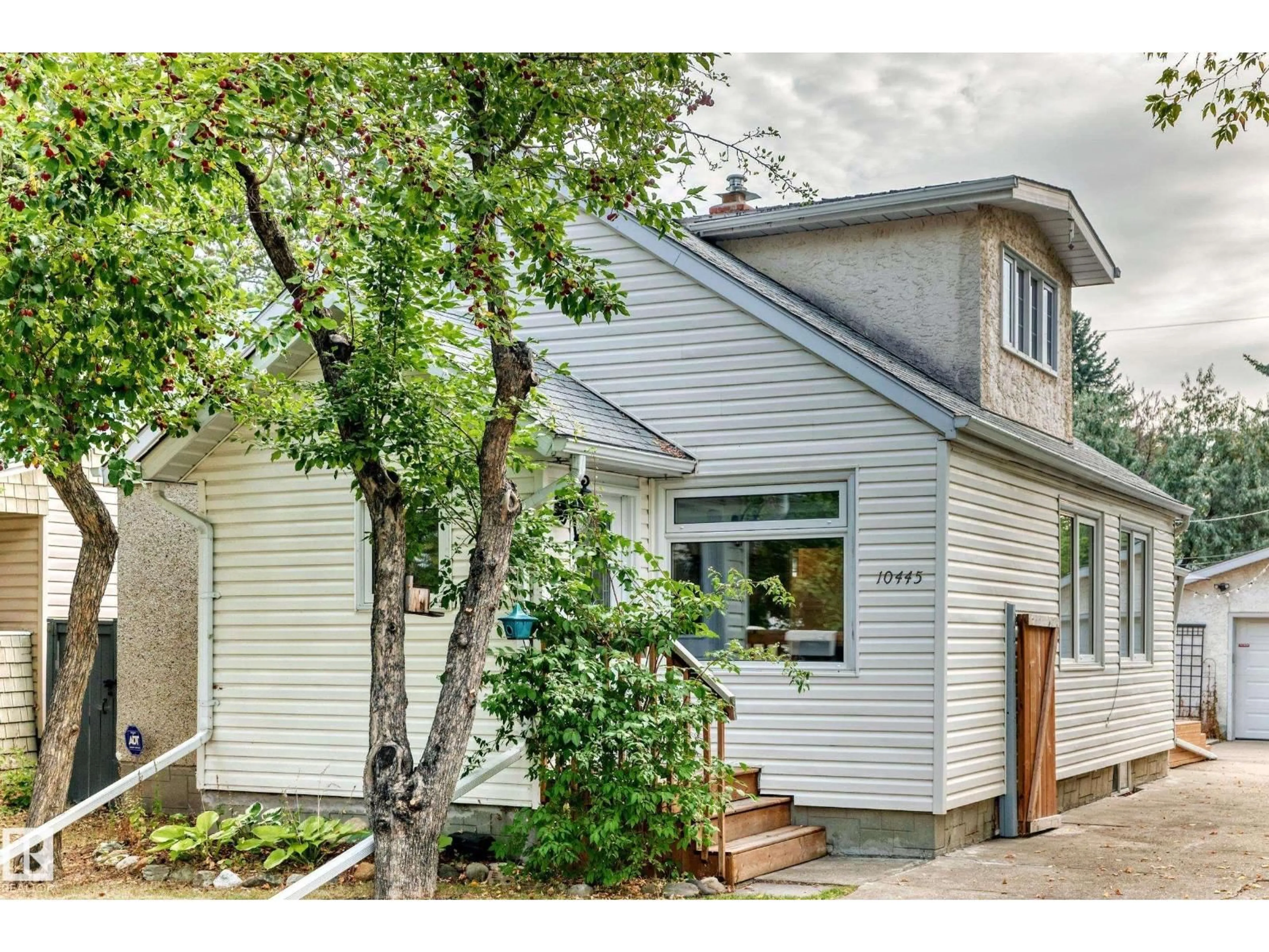 Home with vinyl exterior material, street for 10445 147 ST, Edmonton Alberta T5N3C4