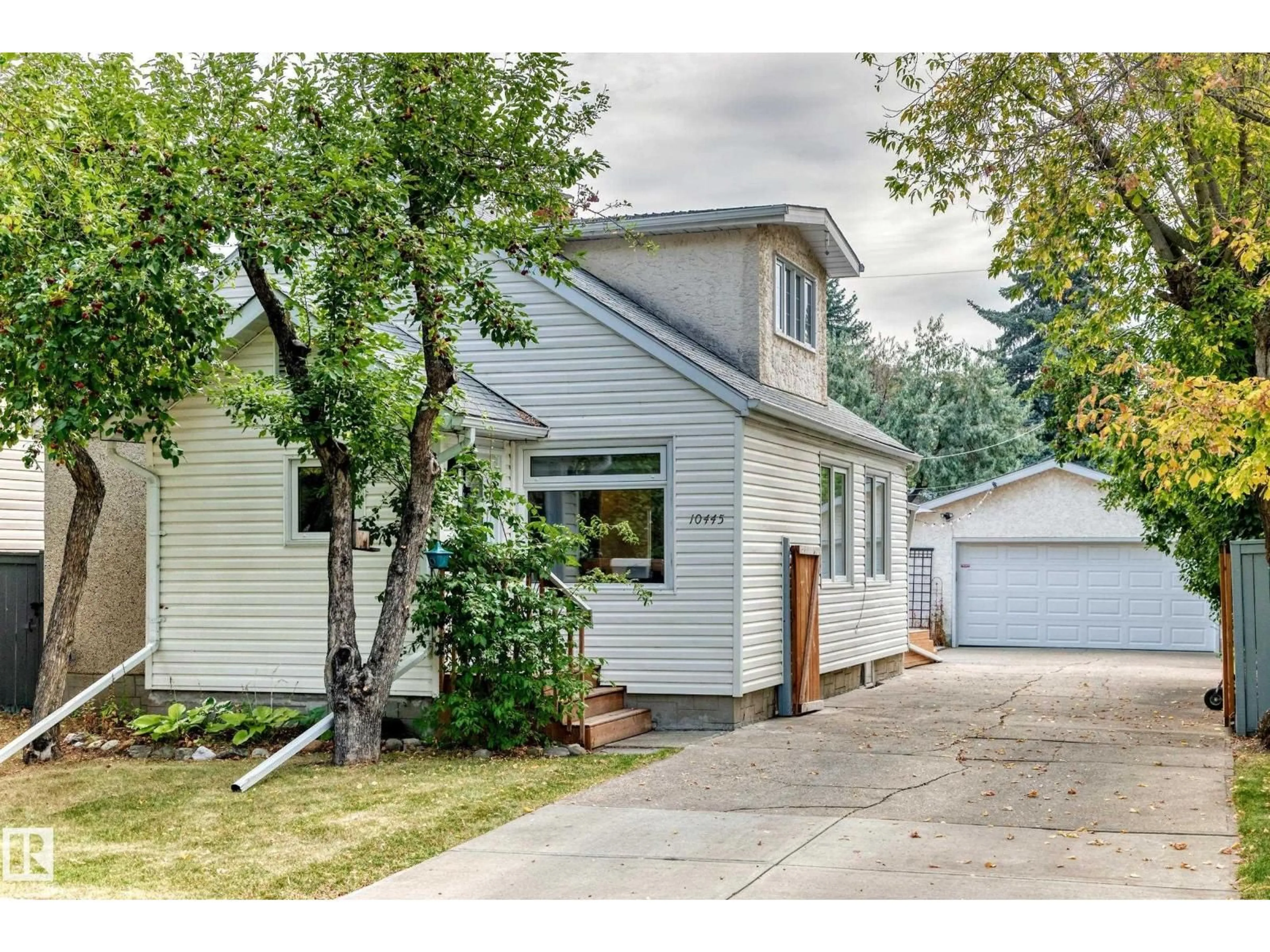 Home with vinyl exterior material, street for 10445 147 ST, Edmonton Alberta T5N3C4