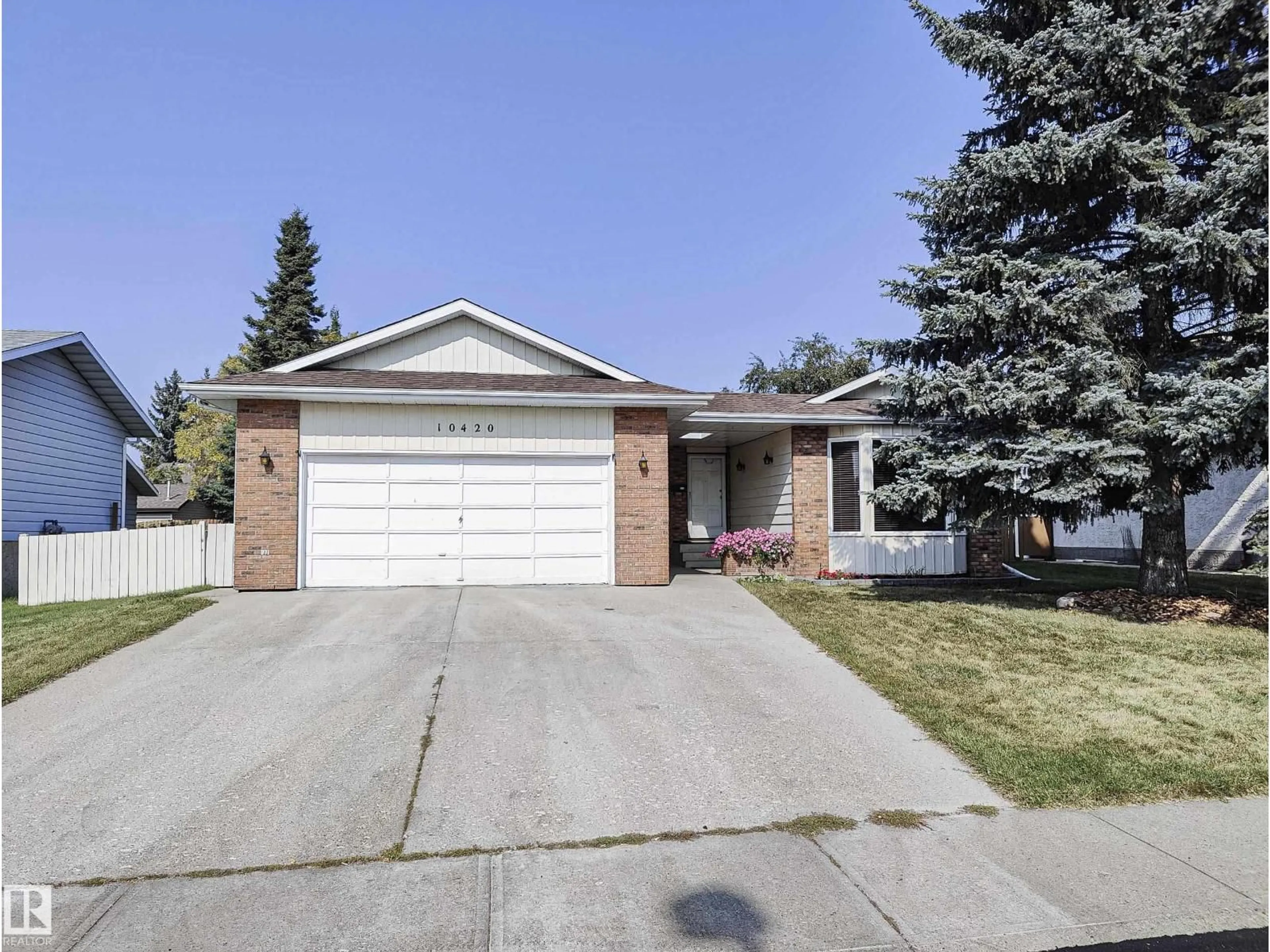 Home with vinyl exterior material, street for 10420 18 AV, Edmonton Alberta T6J4Z7