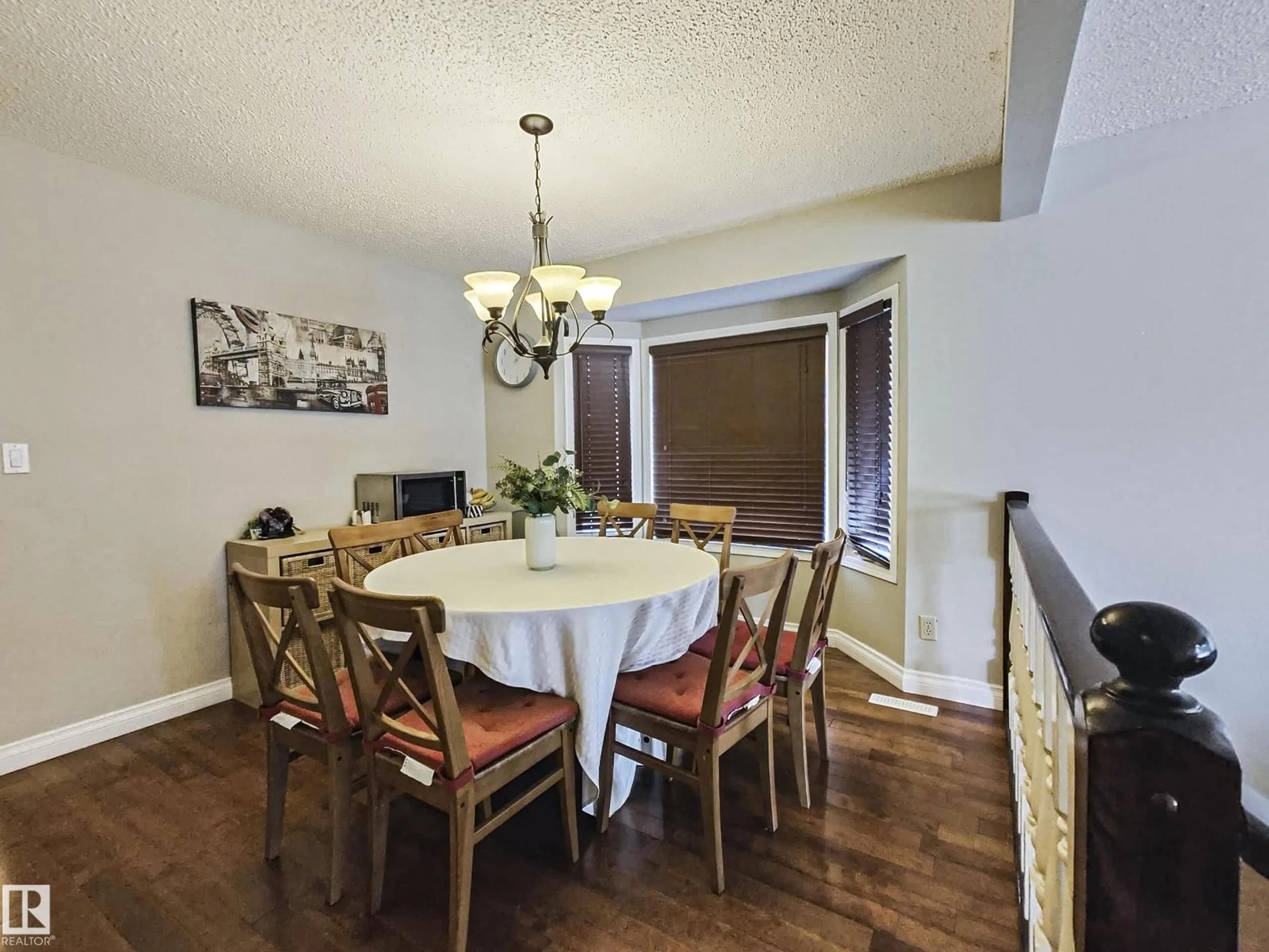 Dining room, wood/laminate floor for 10420 18 AV, Edmonton Alberta T6J4Z7
