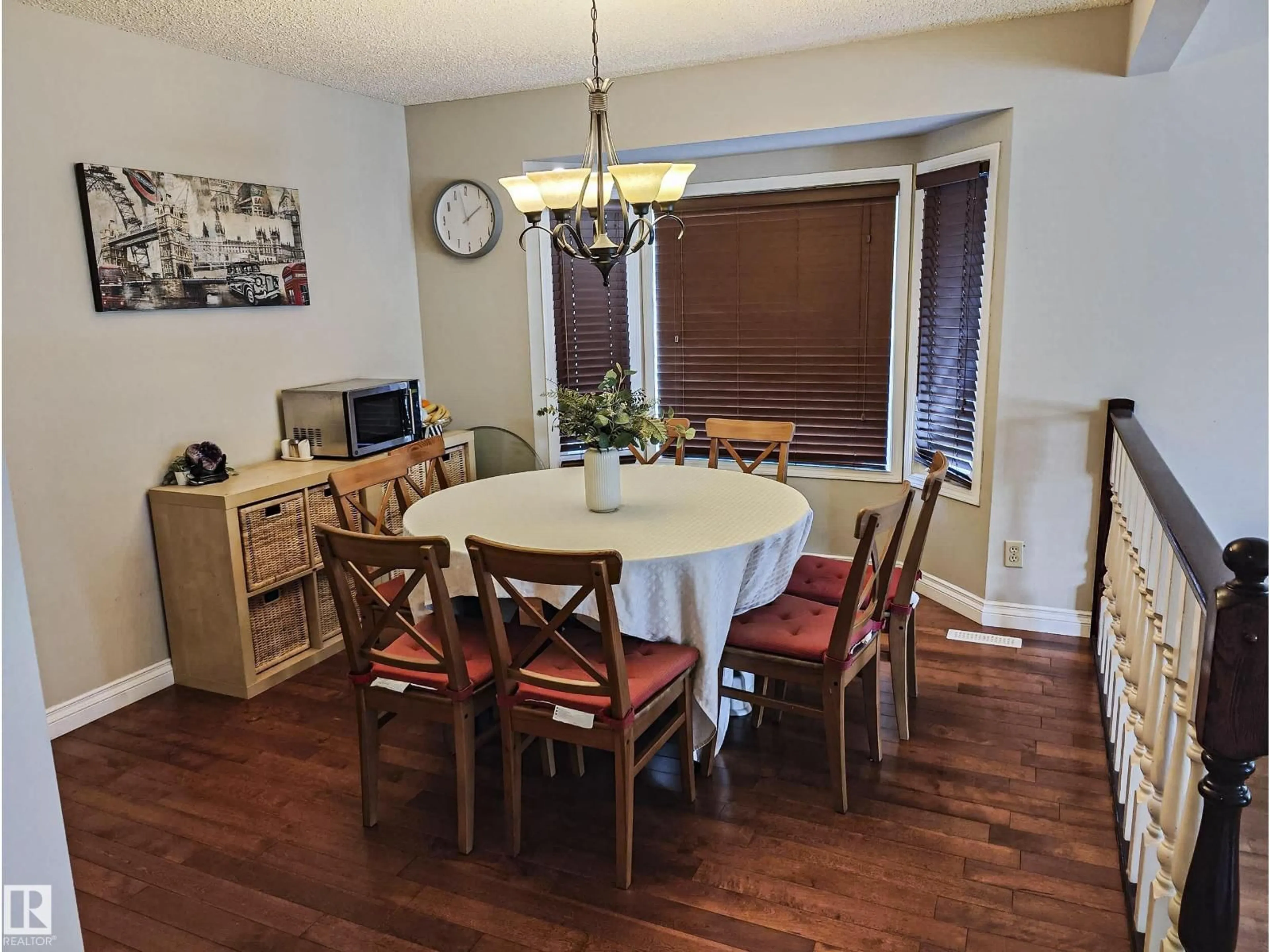 Dining room, wood/laminate floor for 10420 18 AV, Edmonton Alberta T6J4Z7
