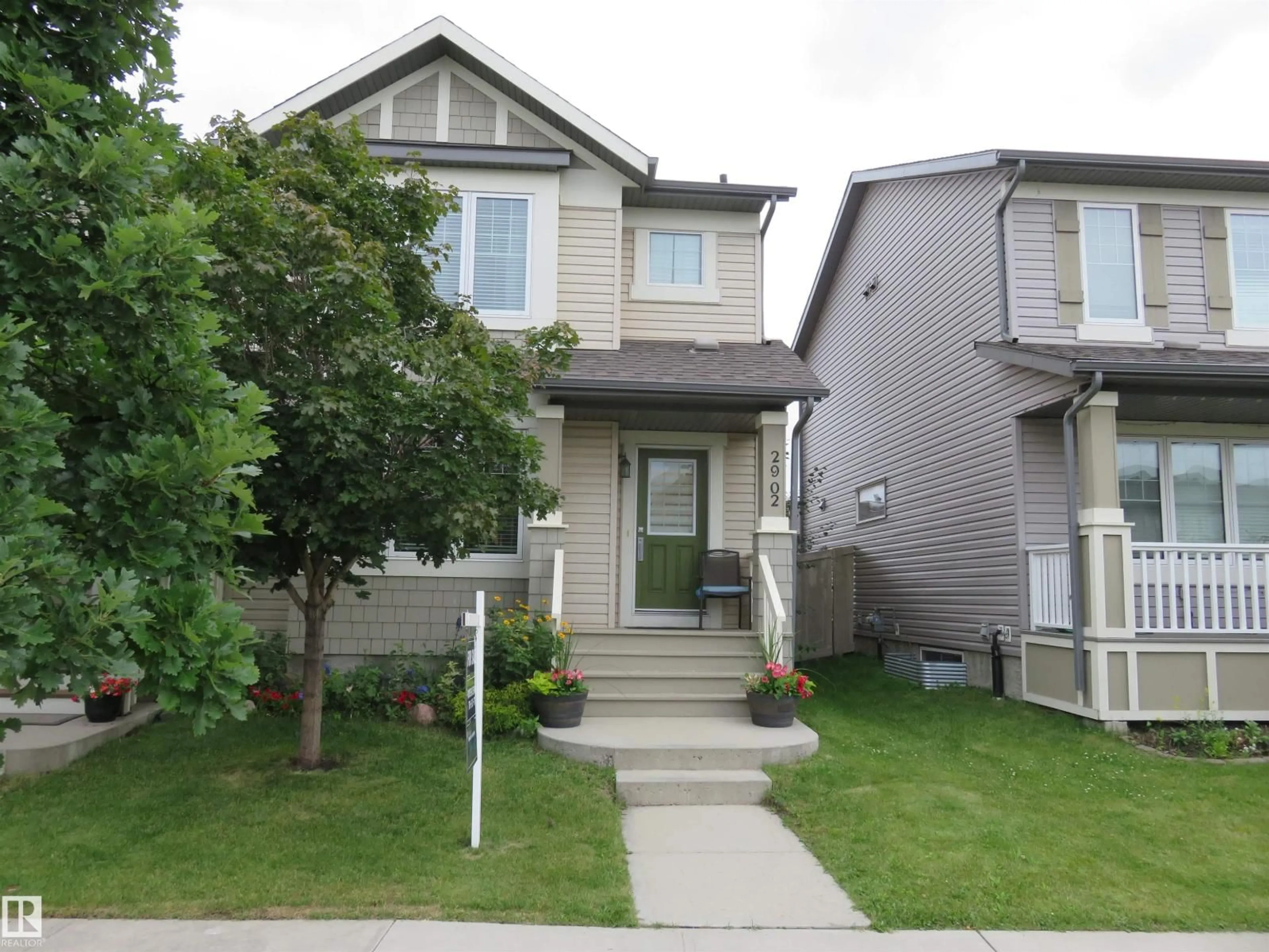 Home with vinyl exterior material, street for 2902 MAPLE WY, Edmonton Alberta T6T0T4