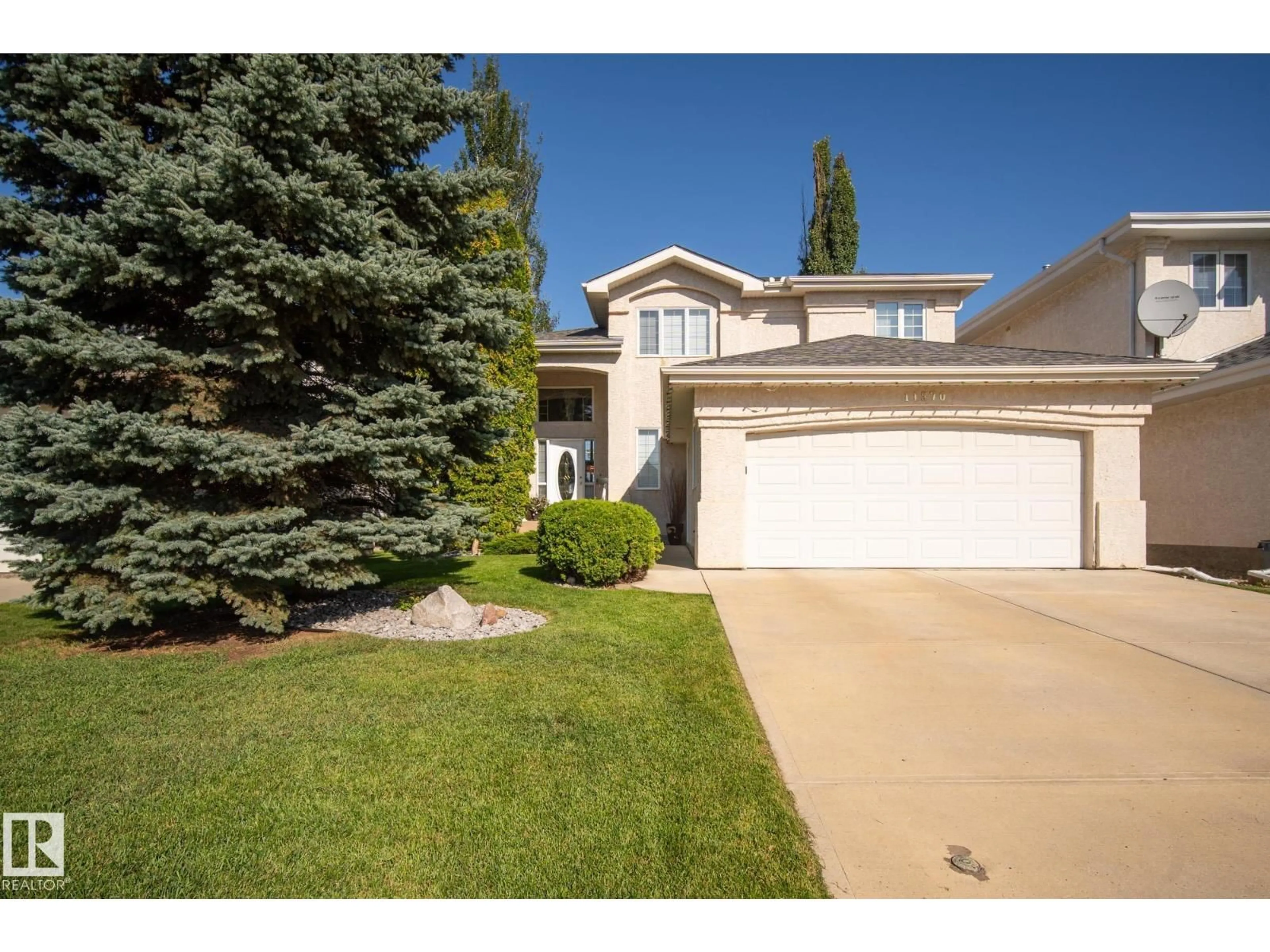 Home with vinyl exterior material, street for 11570 13 AV, Edmonton Alberta T6J7B3