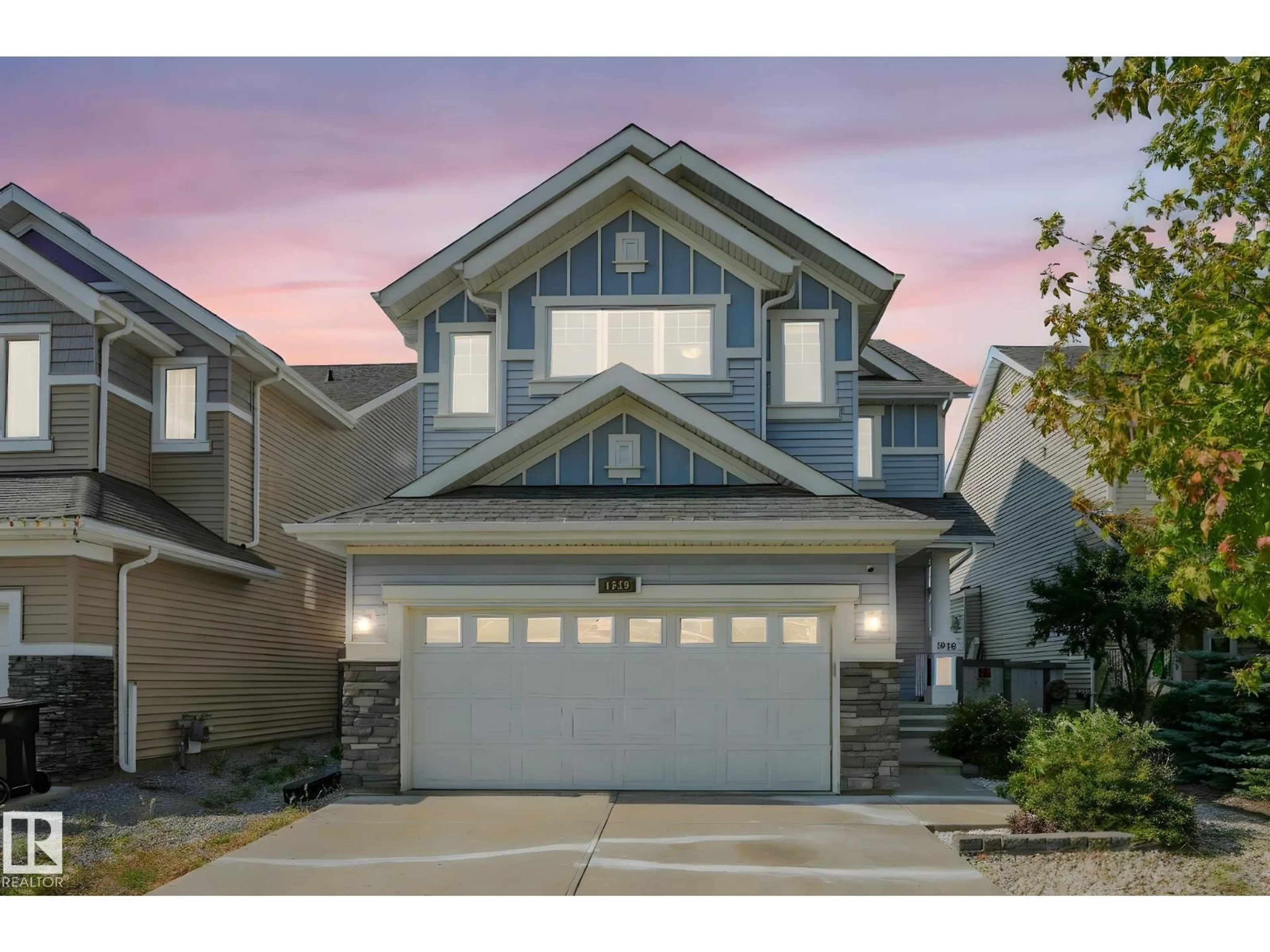 Home with vinyl exterior material, street for SW - 1948 78 ST, Edmonton Alberta T6X1W3