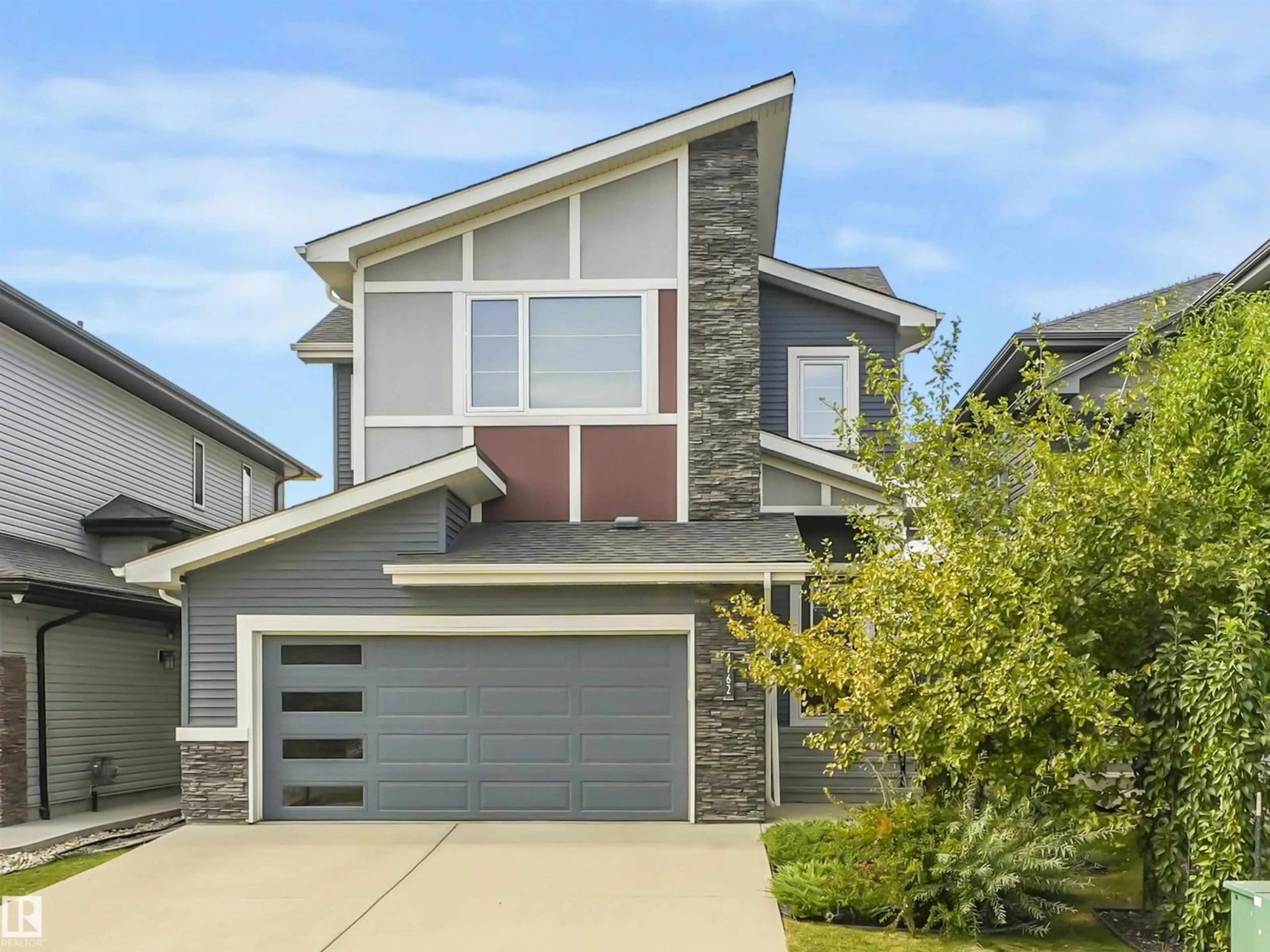 Home with vinyl exterior material, street for 4162 CHARLES LI SW, Edmonton Alberta T6W3H1