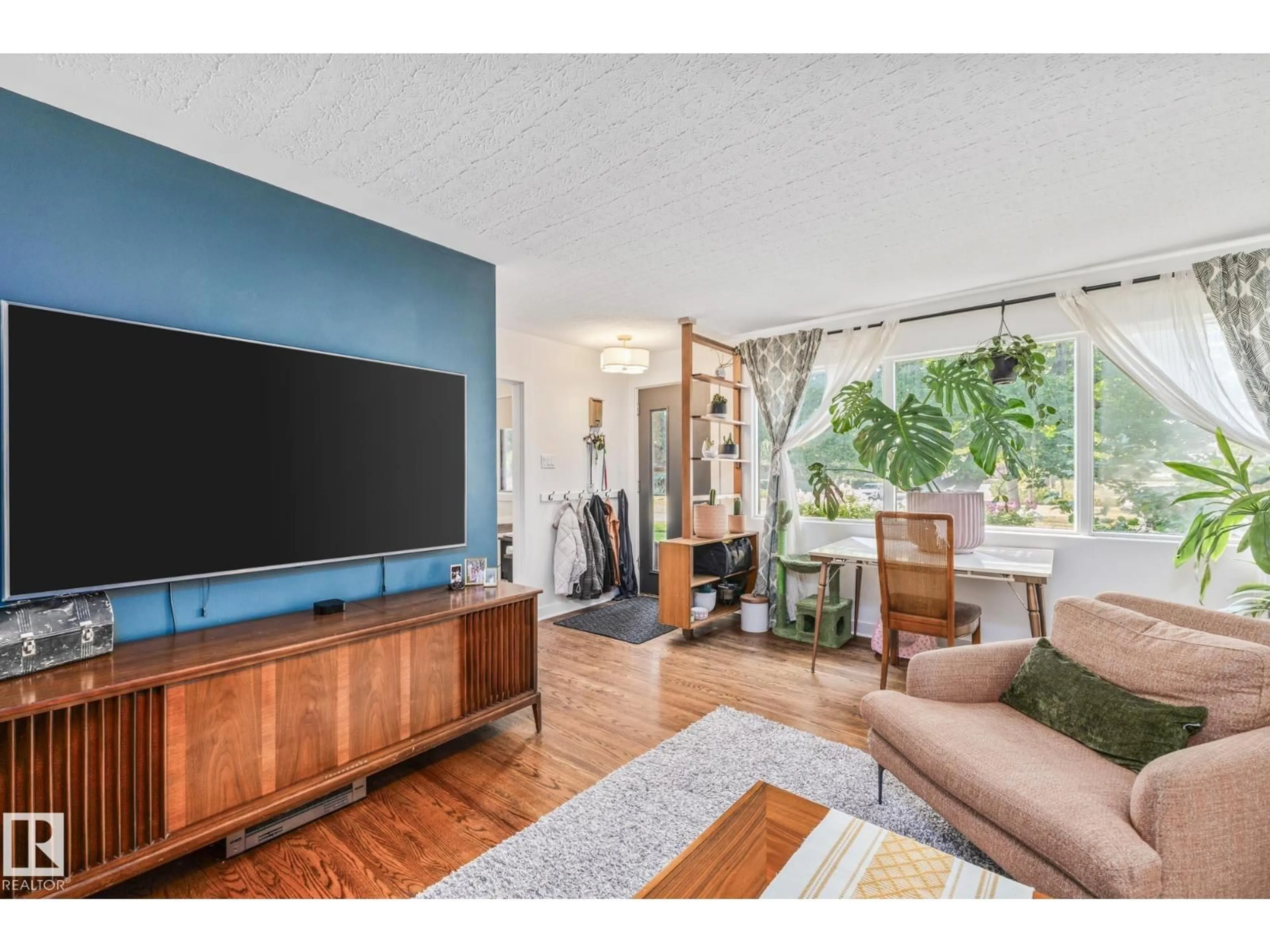 Living room with furniture, wood/laminate floor for 13515 124 ST, Edmonton Alberta T5L0R7