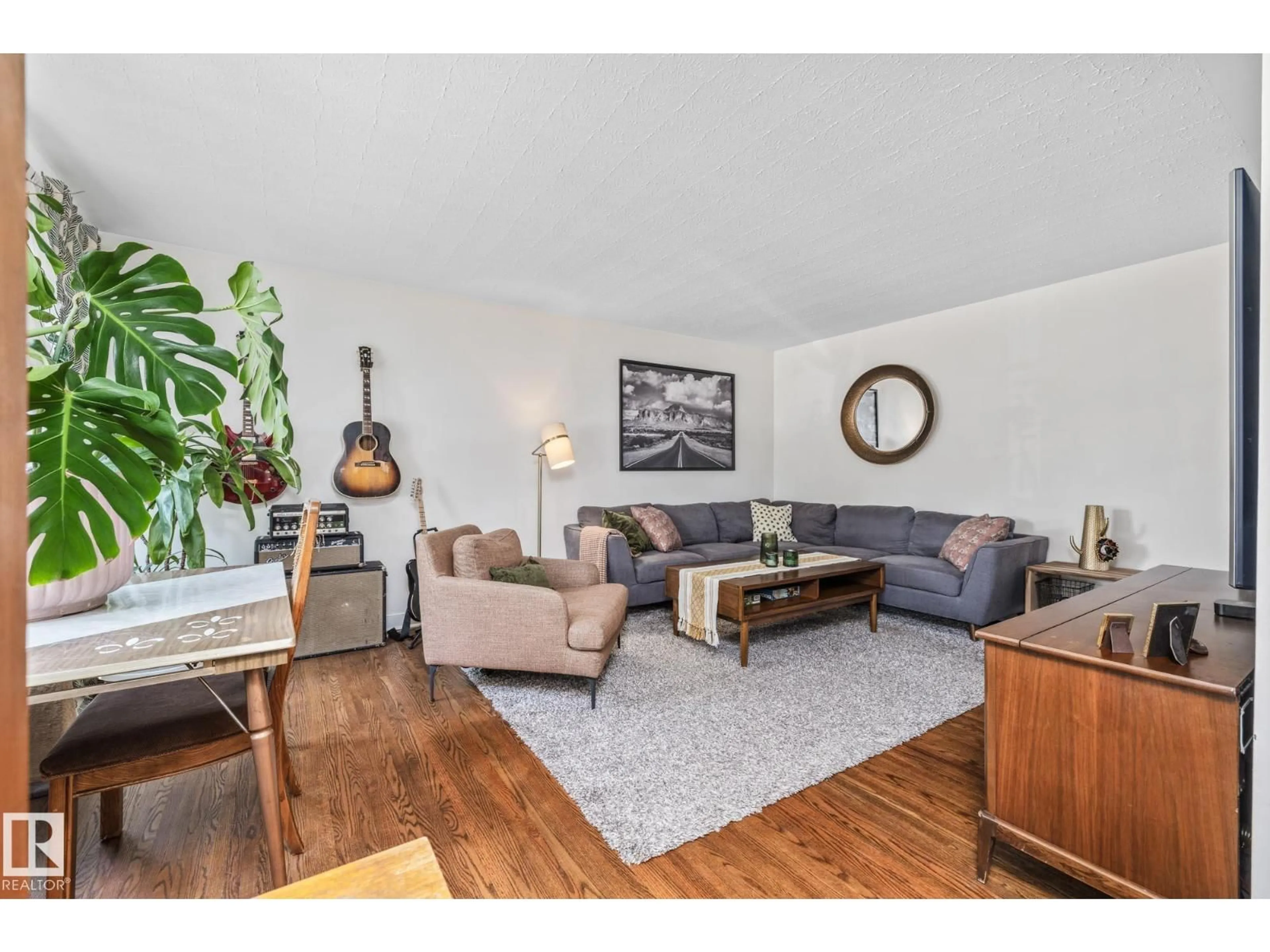 Living room with furniture, wood/laminate floor for 13515 124 ST, Edmonton Alberta T5L0R7