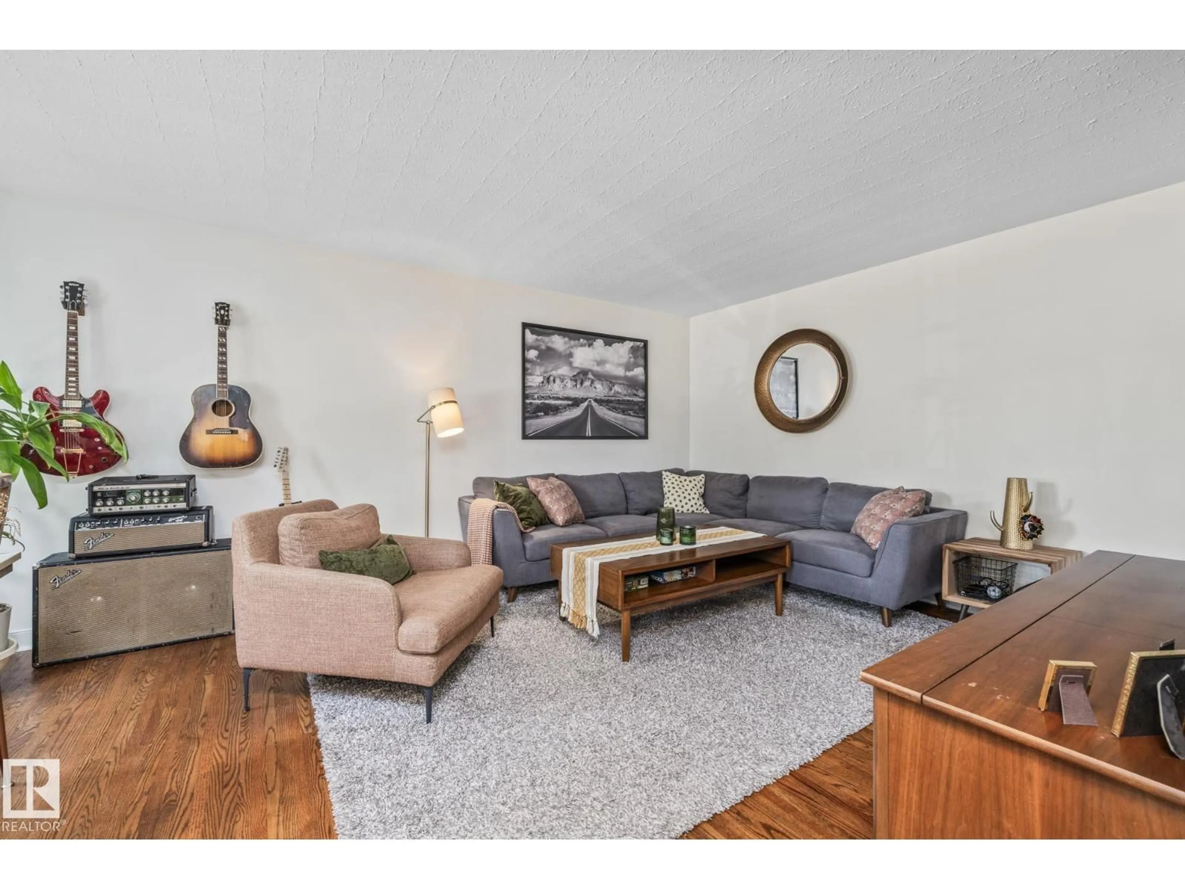 Living room with furniture, wood/laminate floor for 13515 124 ST, Edmonton Alberta T5L0R7