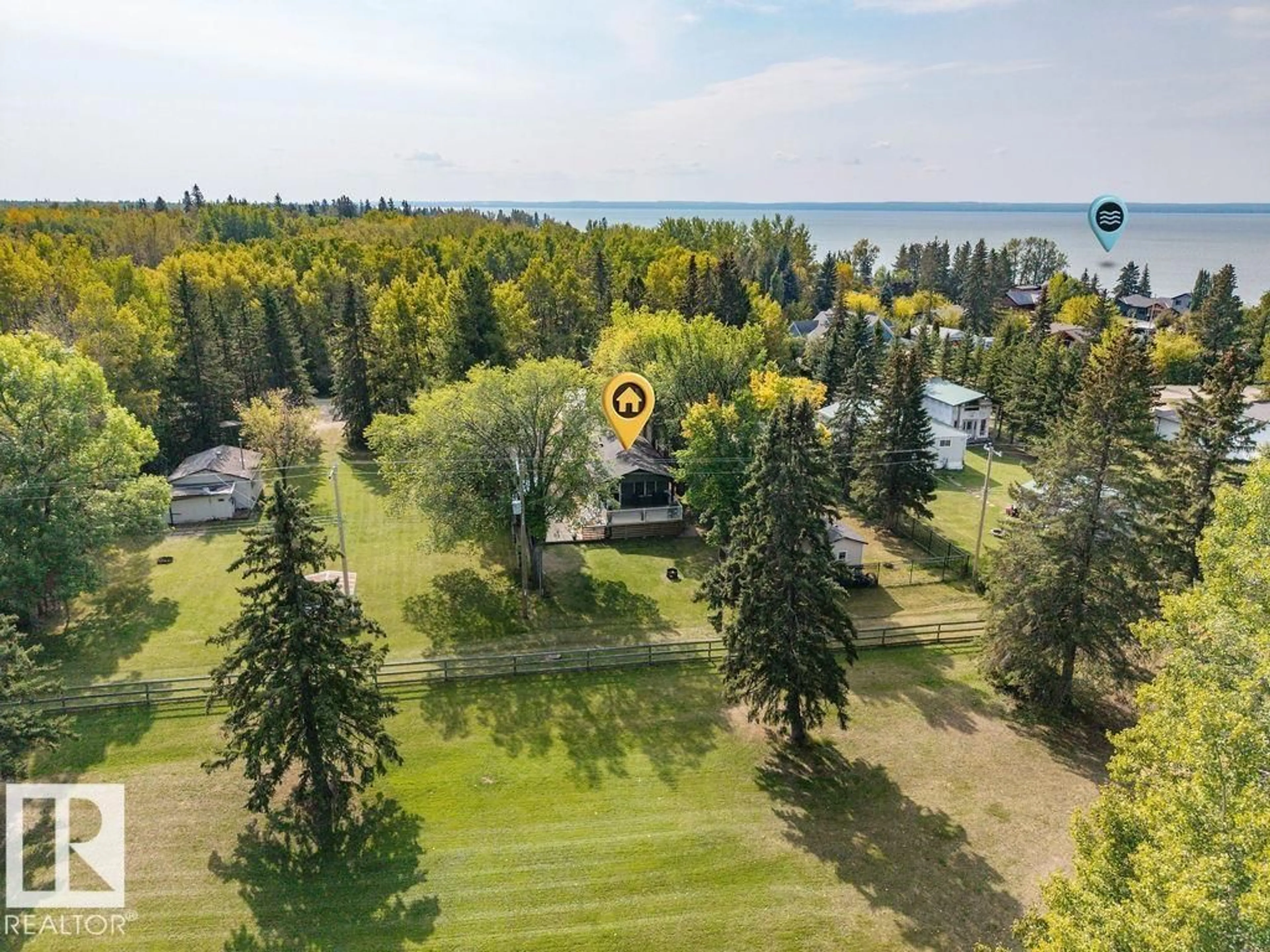 A pic from outside/outdoor area/front of a property/back of a property/a pic from drone, water/lake/river/ocean view for 4472 50 AV, Rural Wetaskiwin County Alberta T0C2C0