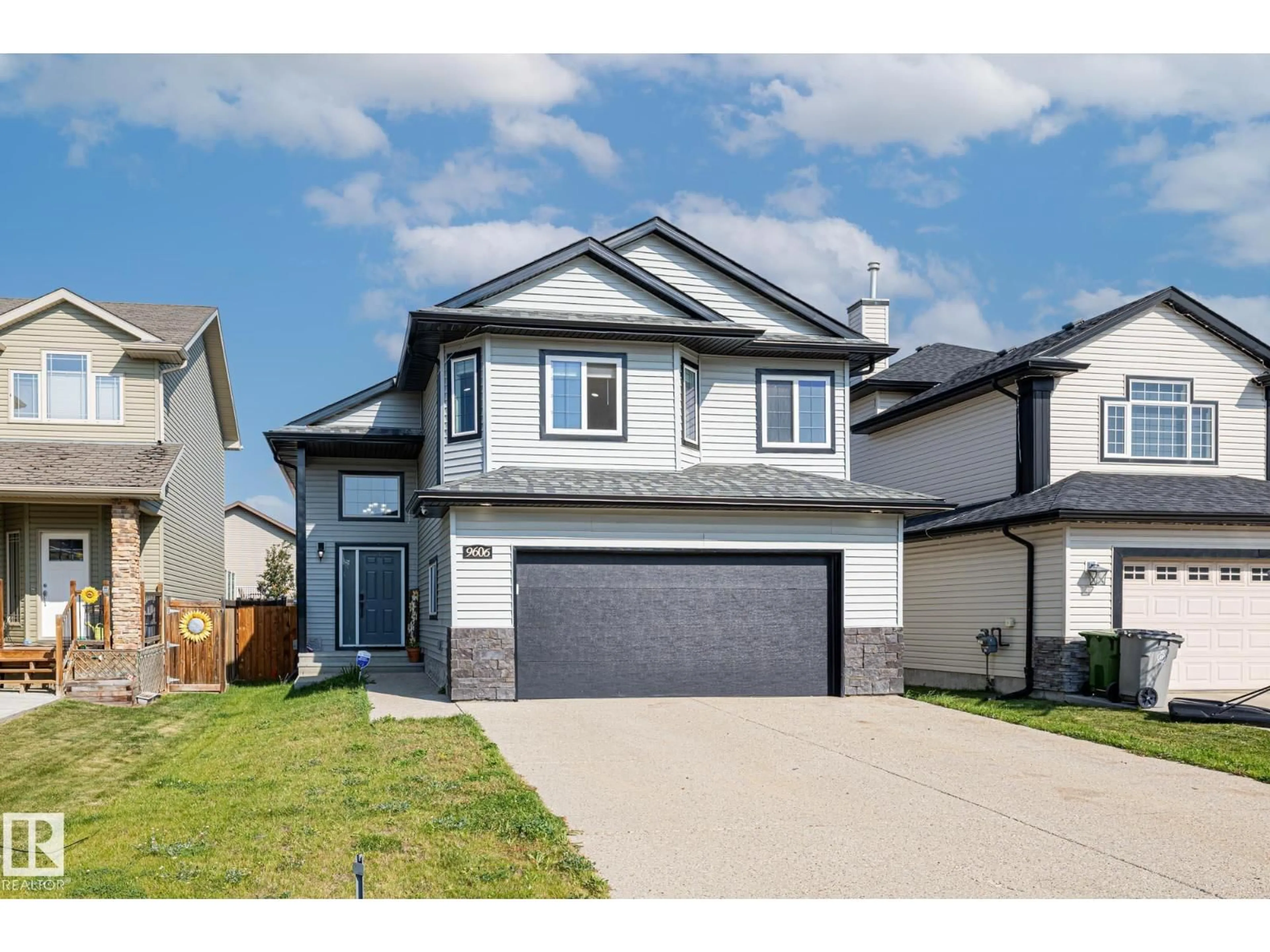 Home with vinyl exterior material, street for 9606 83 AV, Morinville Alberta T8R0A6