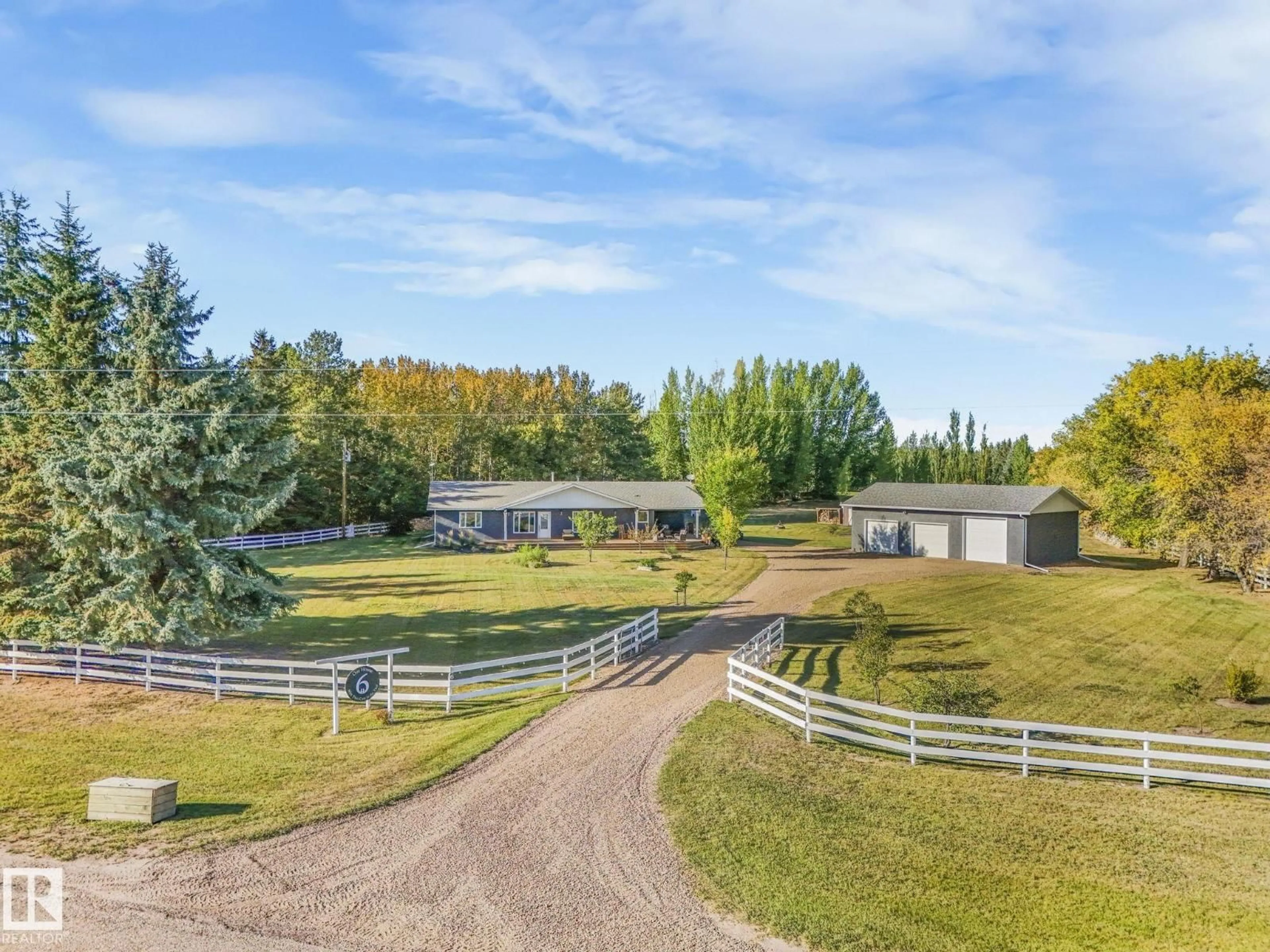 A pic from outside/outdoor area/front of a property/back of a property/a pic from drone, mountain view for #6 - 56420 RGE ROAD 231, Rural Sturgeon County Alberta T0A1N4