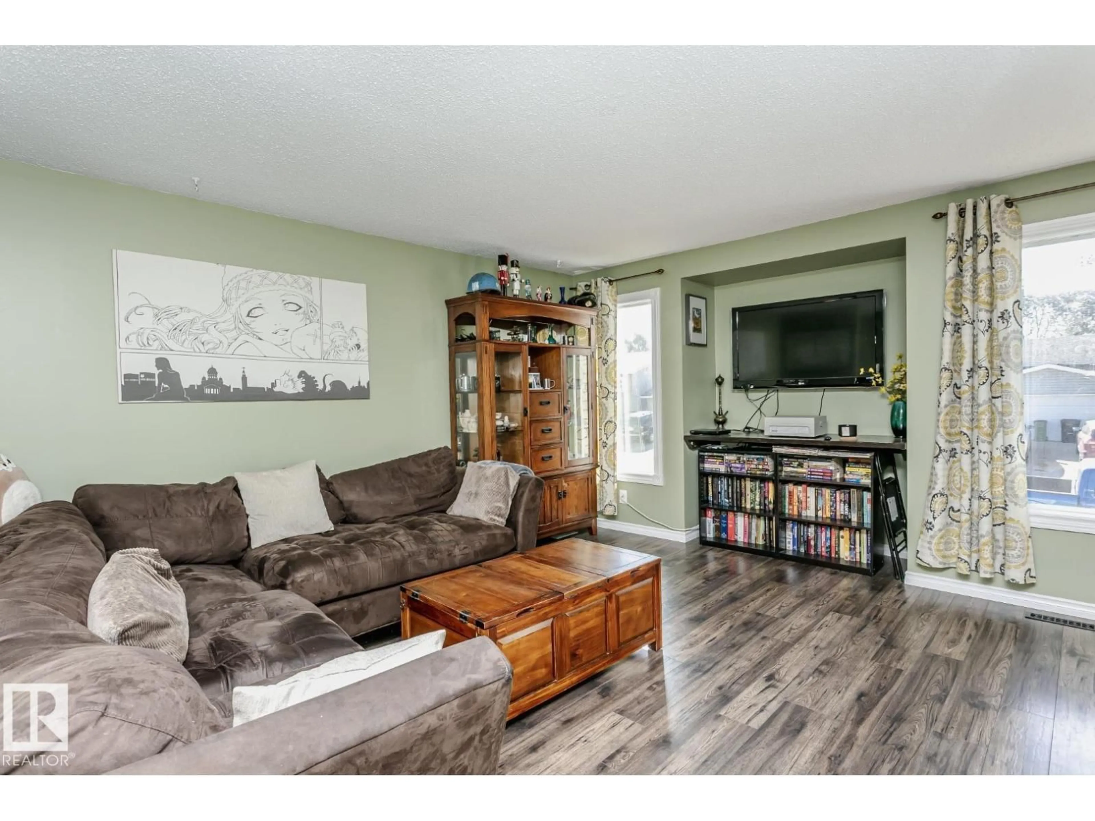 Living room with furniture, wood/laminate floor for 3520 33 AV, Edmonton Alberta T6L5G6