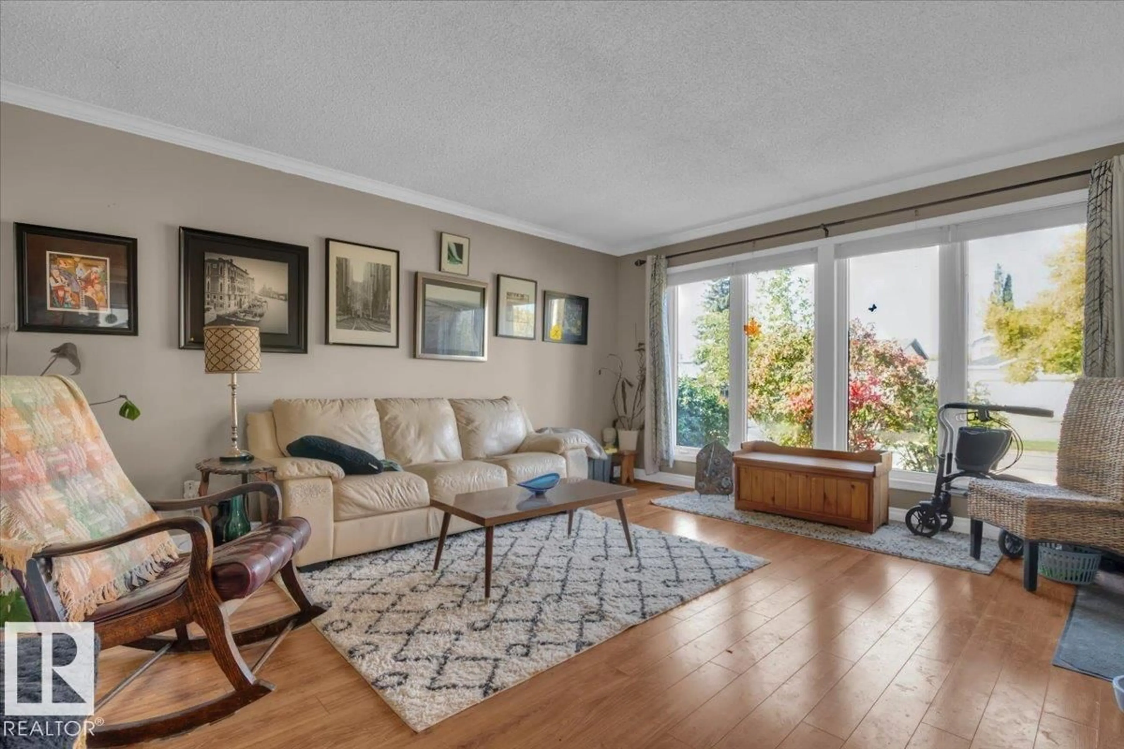 Living room with furniture, wood/laminate floor for 23 LUNNON DR, Gibbons Alberta T0A1N0