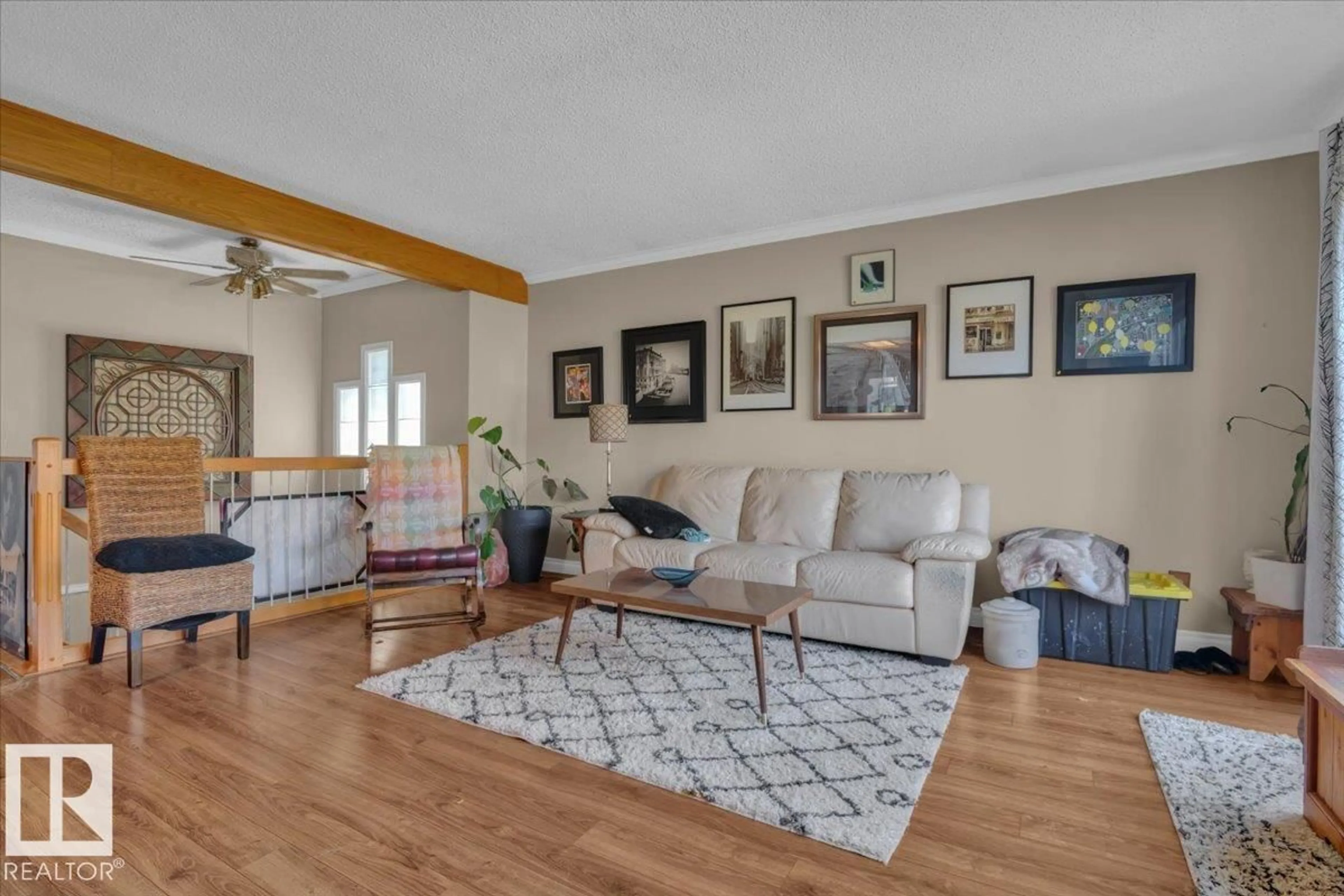 Living room with furniture, wood/laminate floor for 23 LUNNON DR, Gibbons Alberta T0A1N0