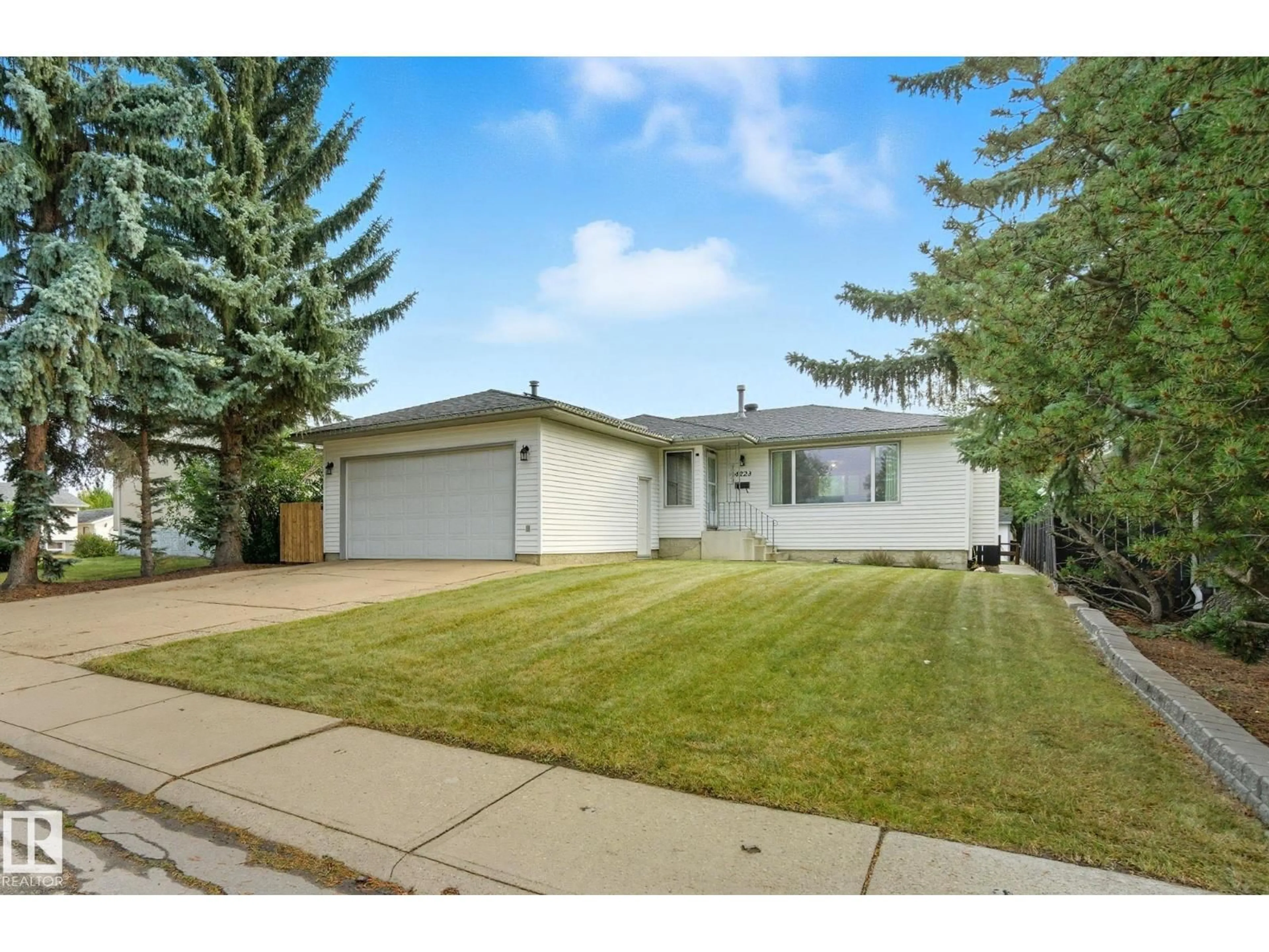 Home with vinyl exterior material, street for NW - 4223 89 ST, Edmonton Alberta T6K1B8