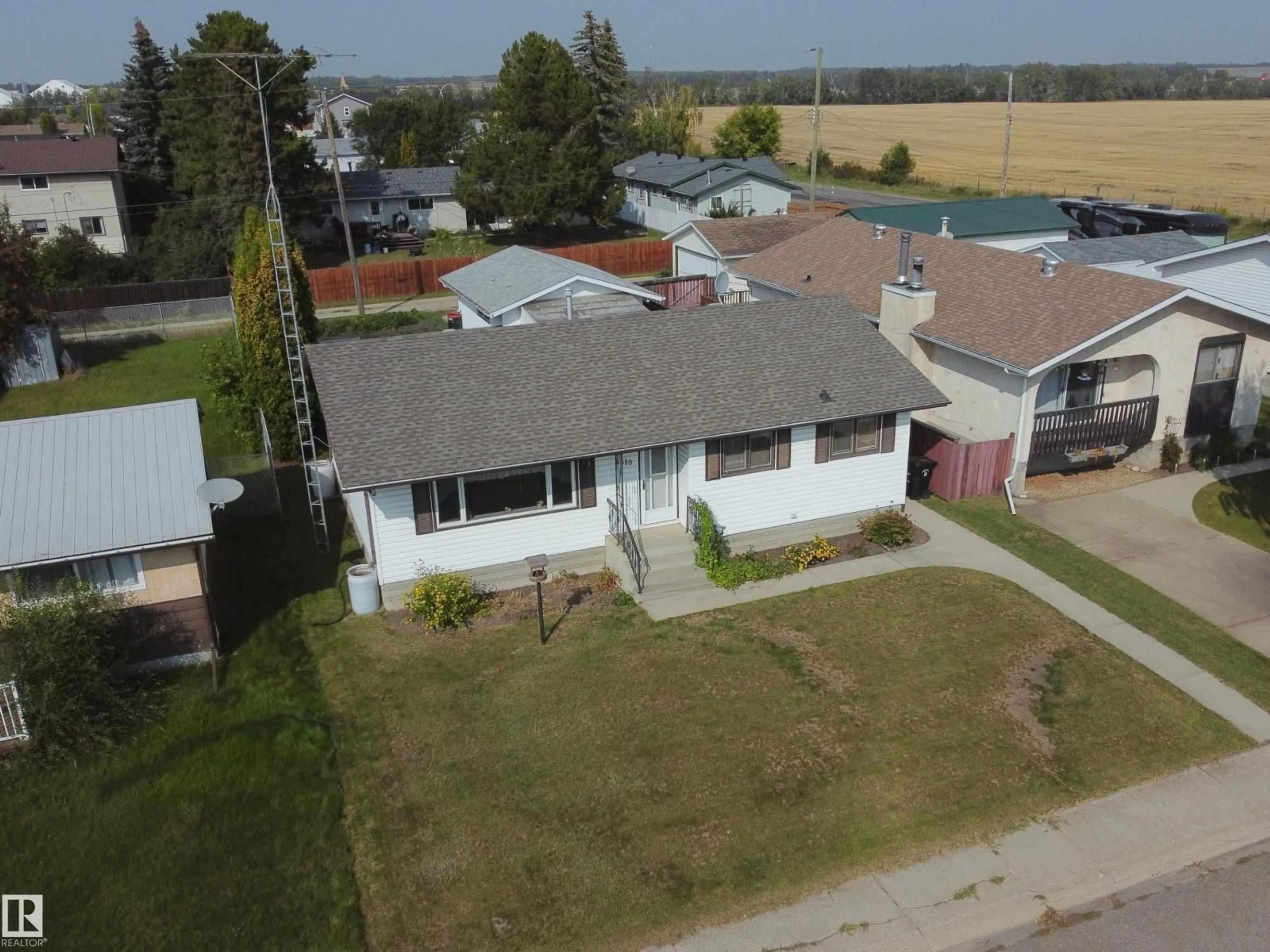 A pic from outside/outdoor area/front of a property/back of a property/a pic from drone, street for 4310 56 AVENUE, Barrhead Alberta T7N1K2