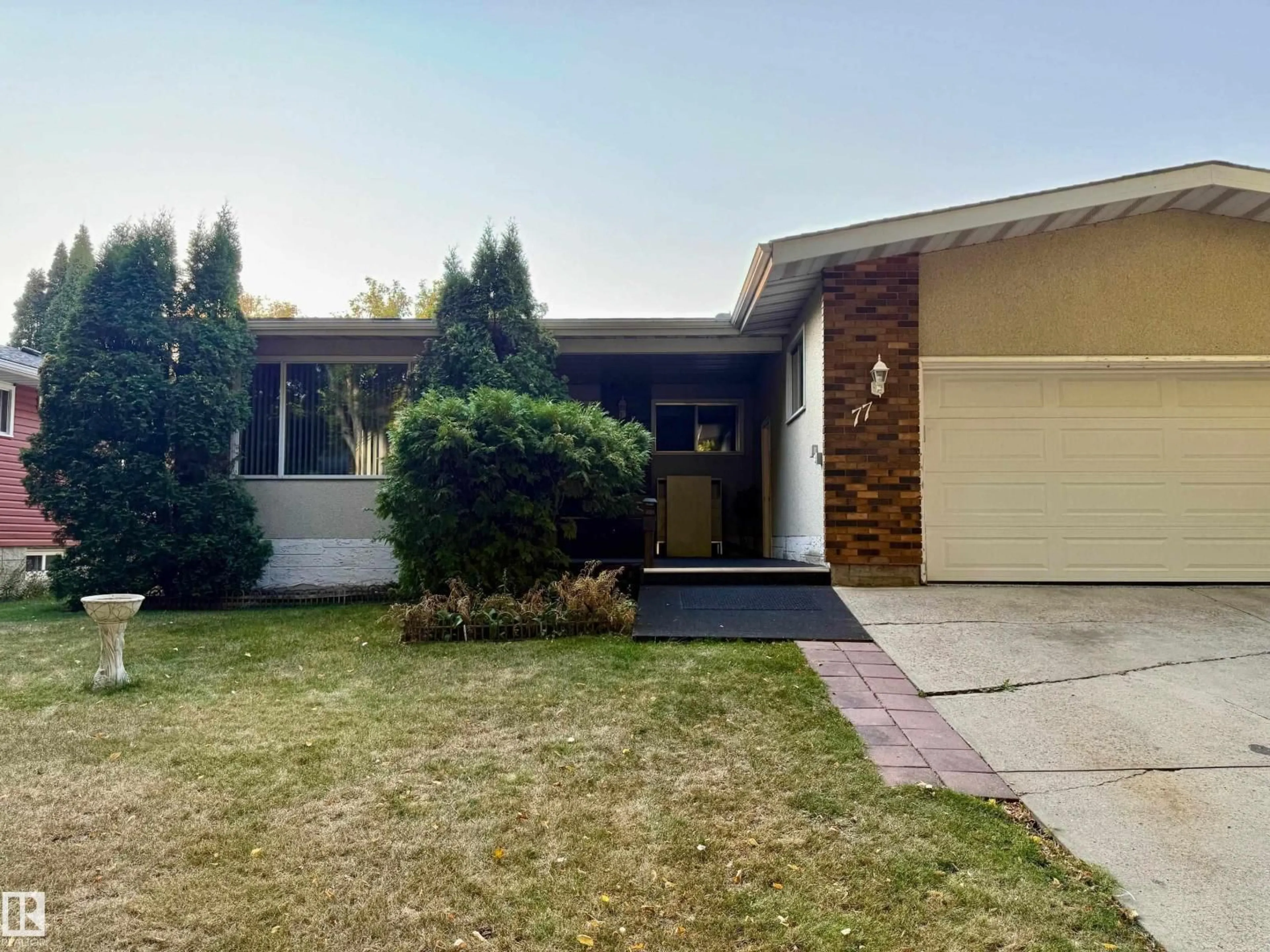 Home with vinyl exterior material, street for 77 FOREST DR, St. Albert Alberta T8N1Z1