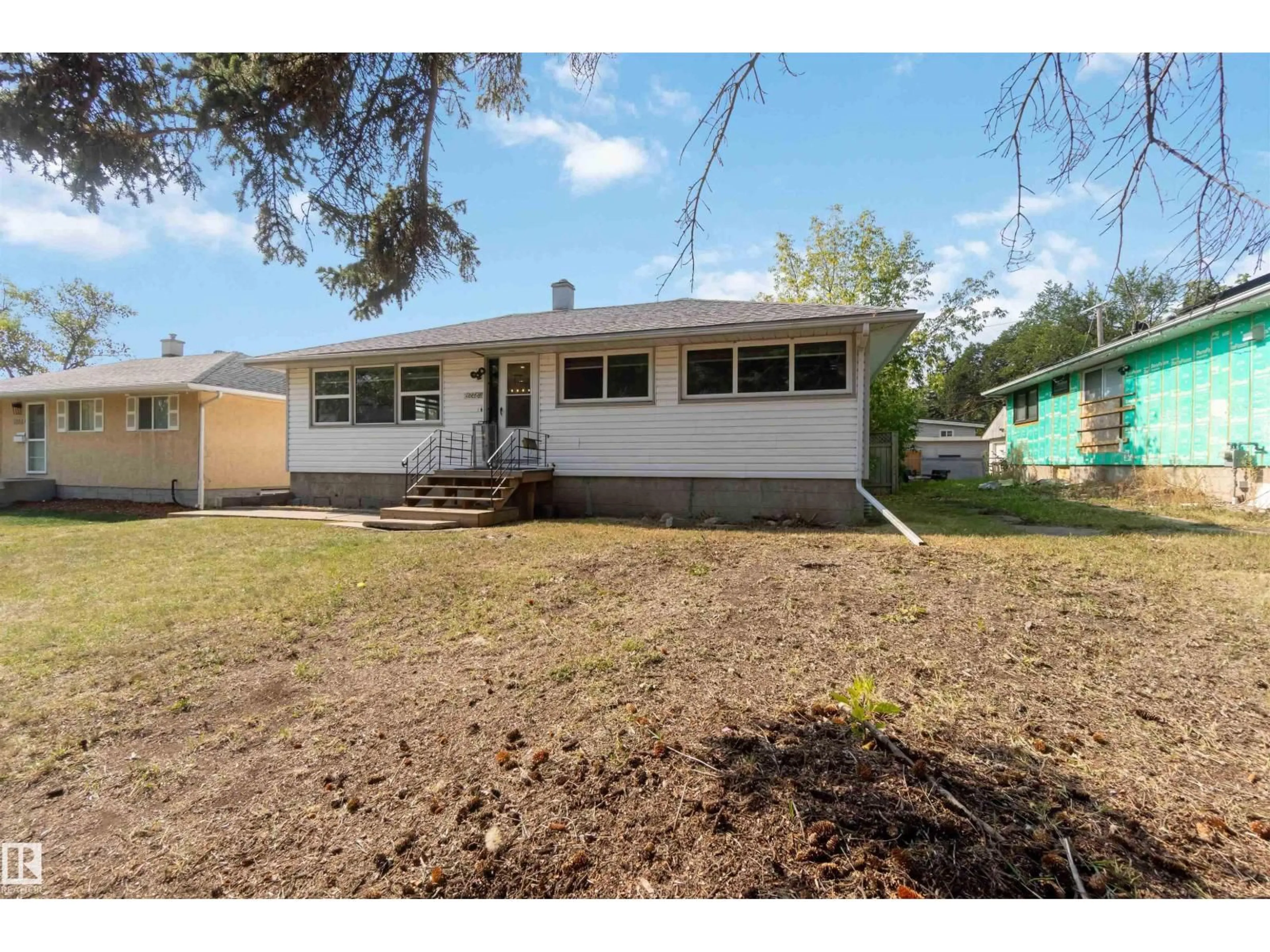 Home with vinyl exterior material, street for NW - 12268 131 ST, Edmonton Alberta T5L1M9
