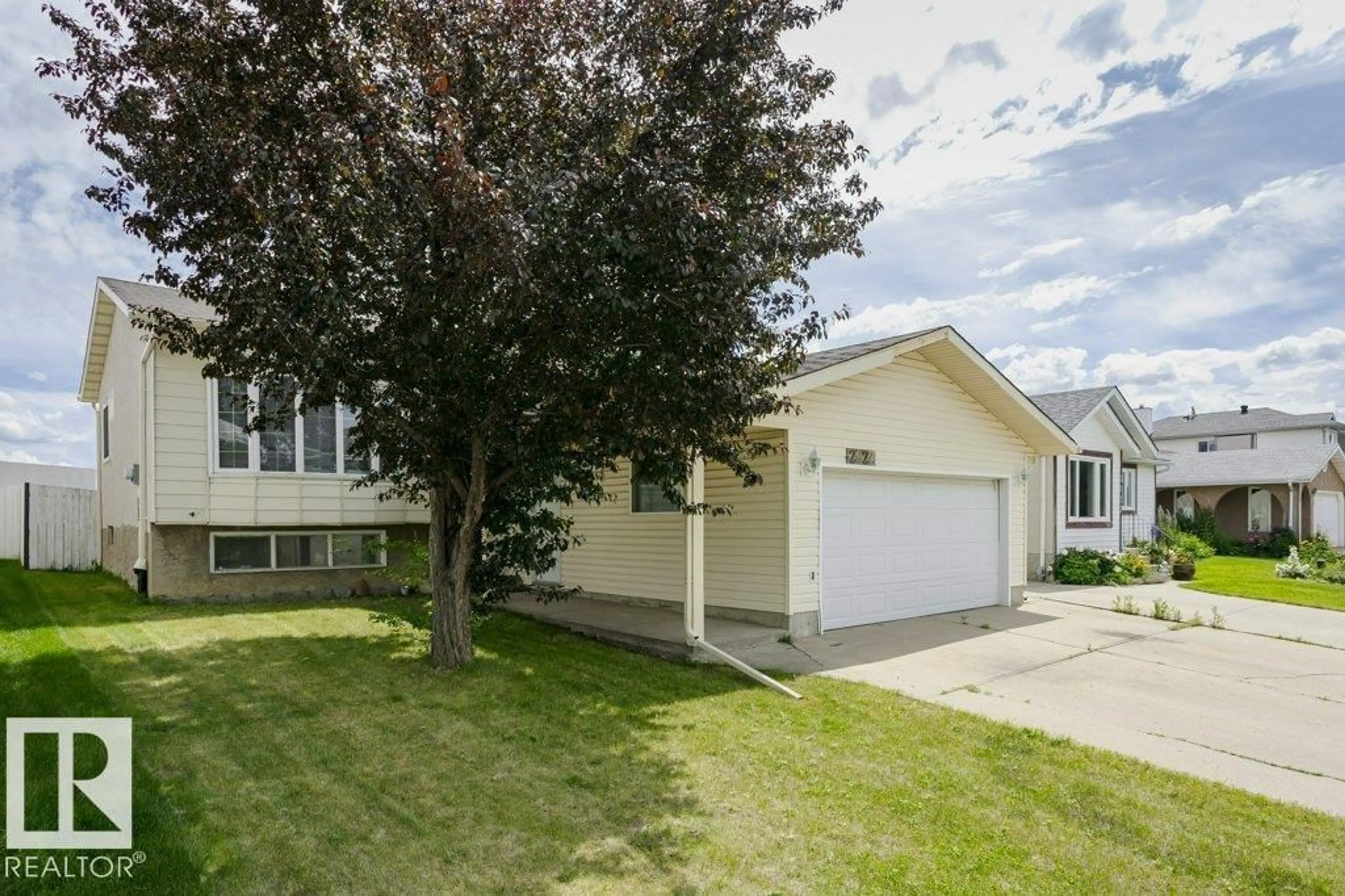 Home with vinyl exterior material, street for 2827 35 ST, Edmonton Alberta T6L5K2