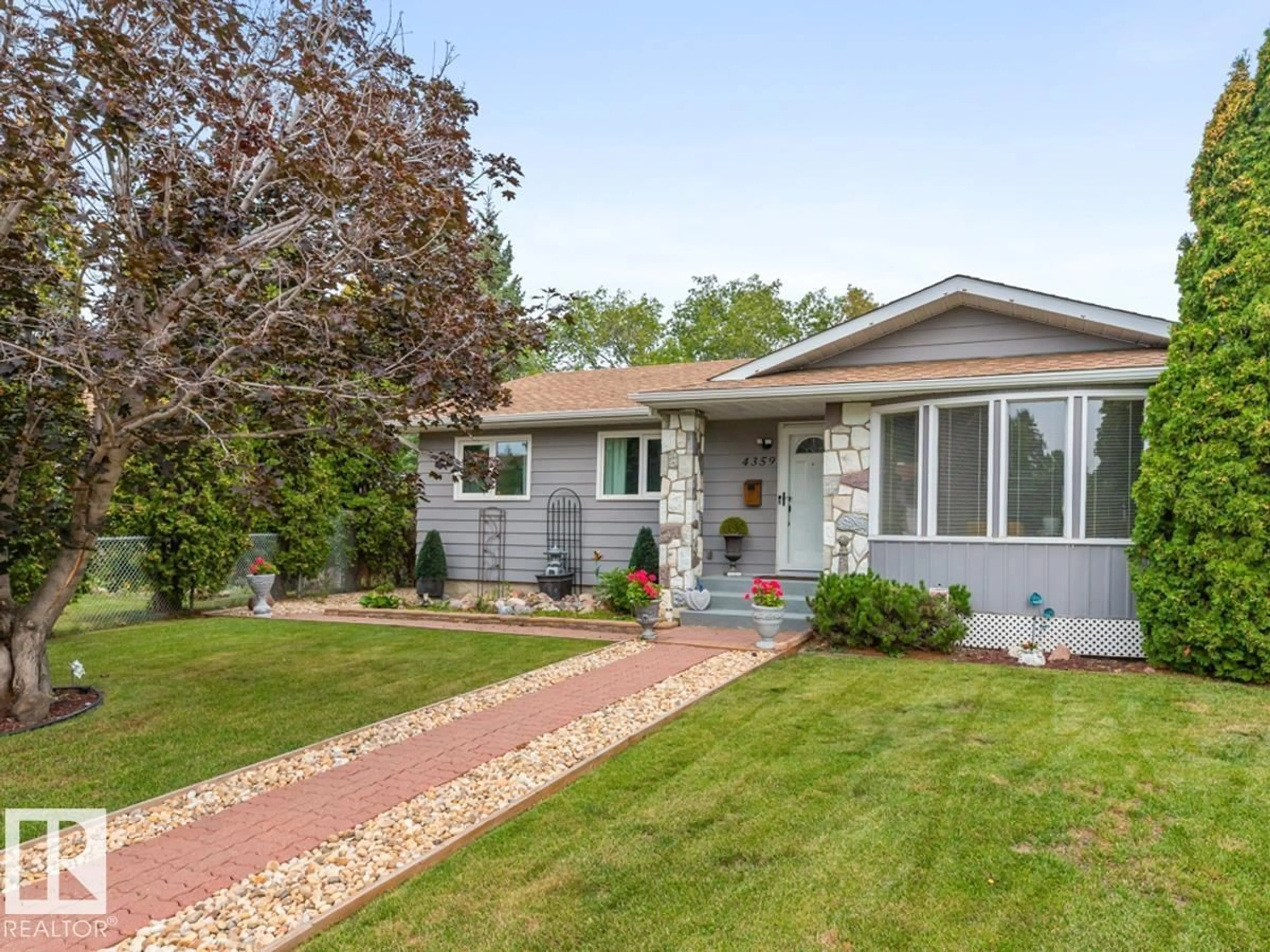 Home with vinyl exterior material, street for 4359 68 ST, Edmonton Alberta T5K0T7