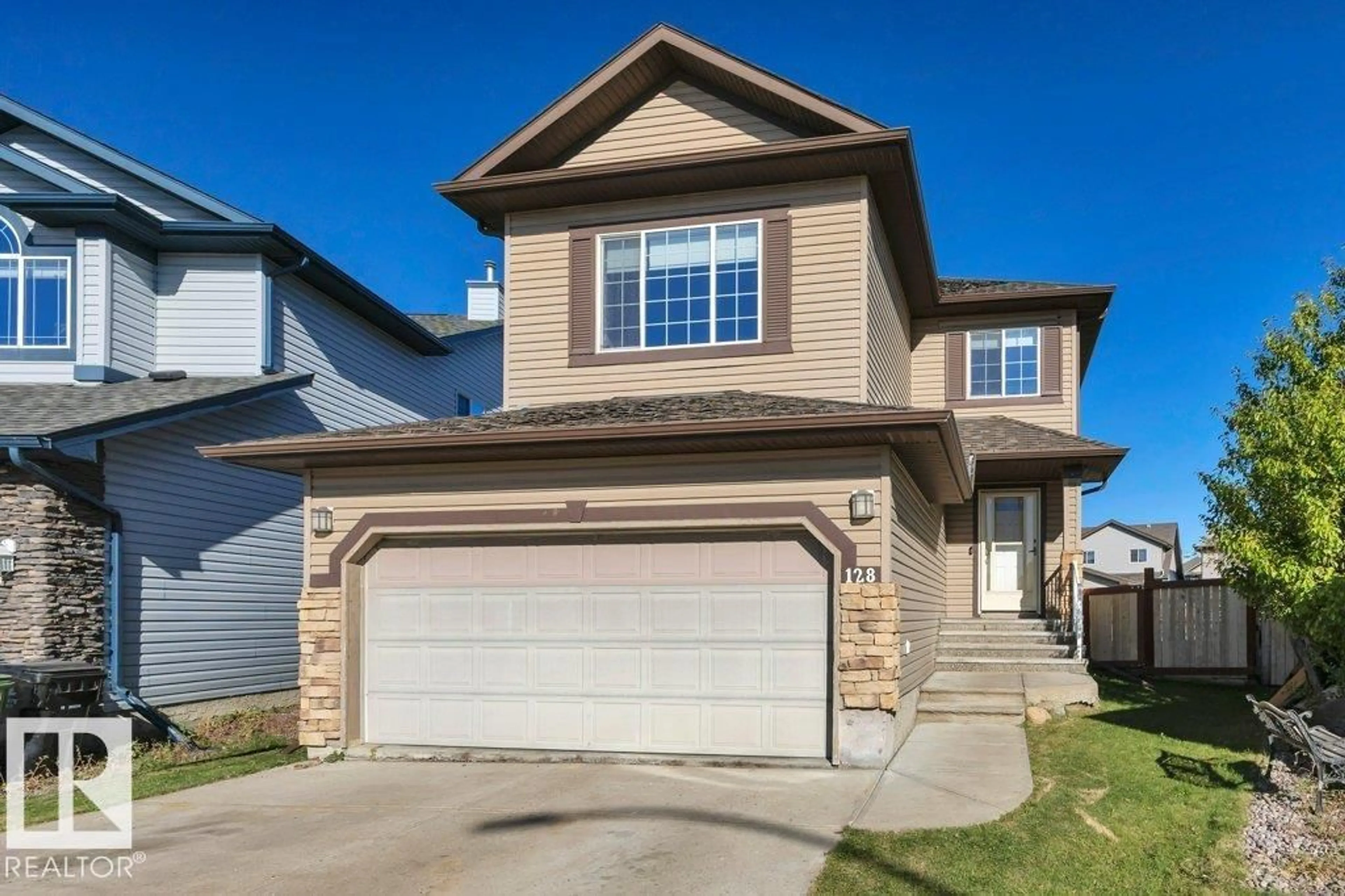 Home with vinyl exterior material, street for 128 SOUTHFORK DR, Leduc Alberta T9E0E9
