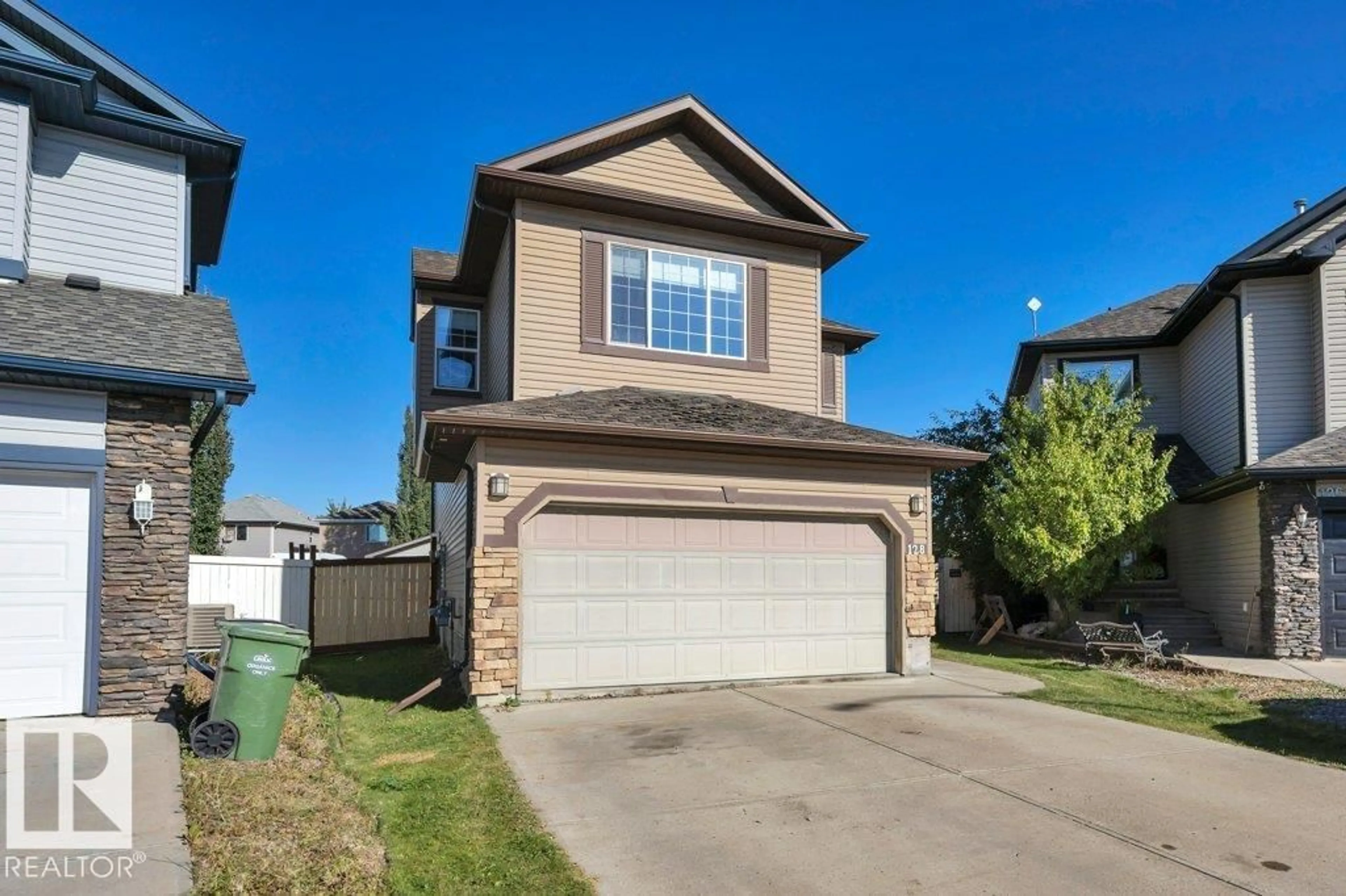 Home with vinyl exterior material, street for 128 SOUTHFORK DR, Leduc Alberta T9E0E9