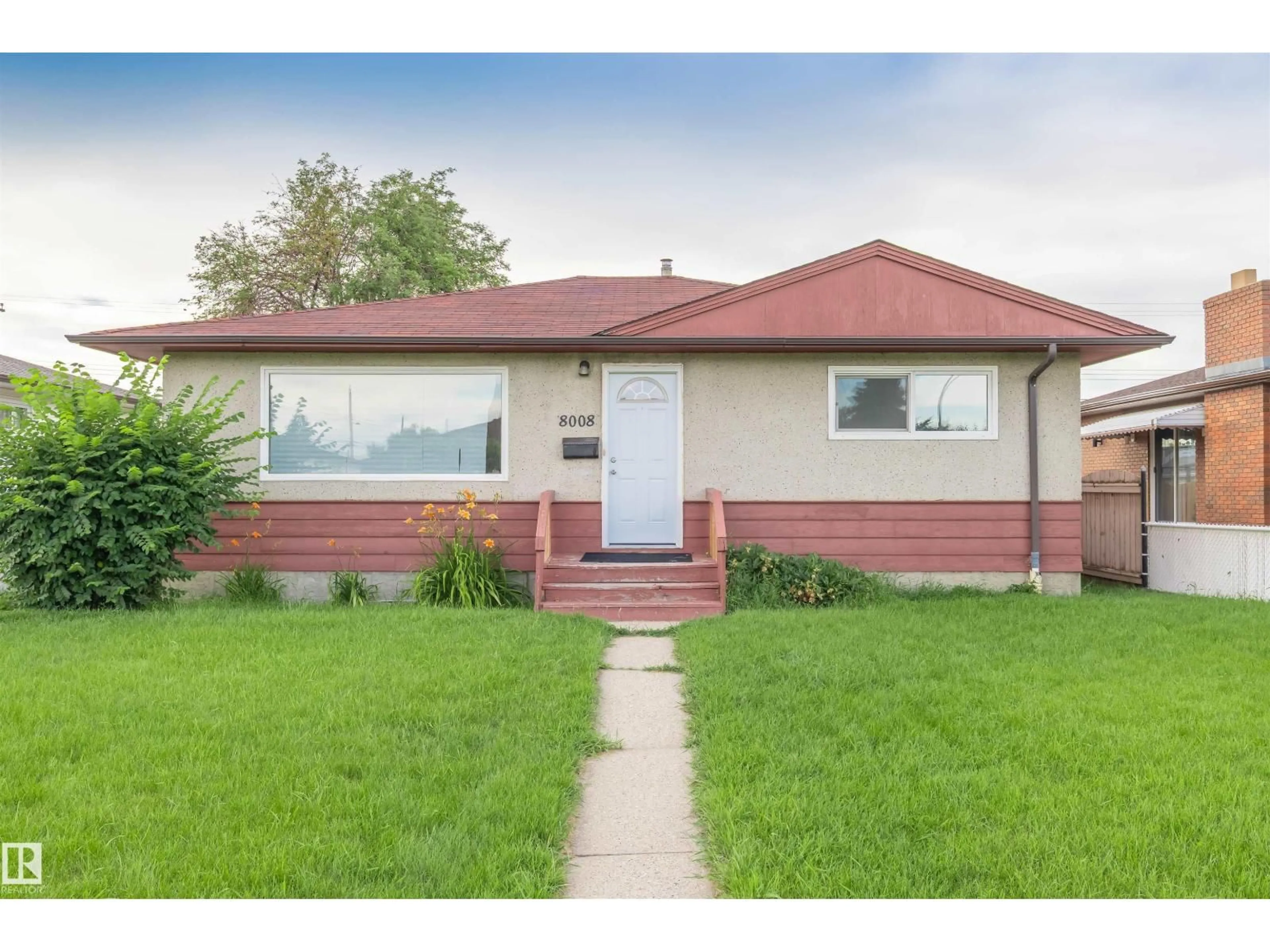 Home with vinyl exterior material, street for 8008 129A AV, Edmonton Alberta T5C1X2