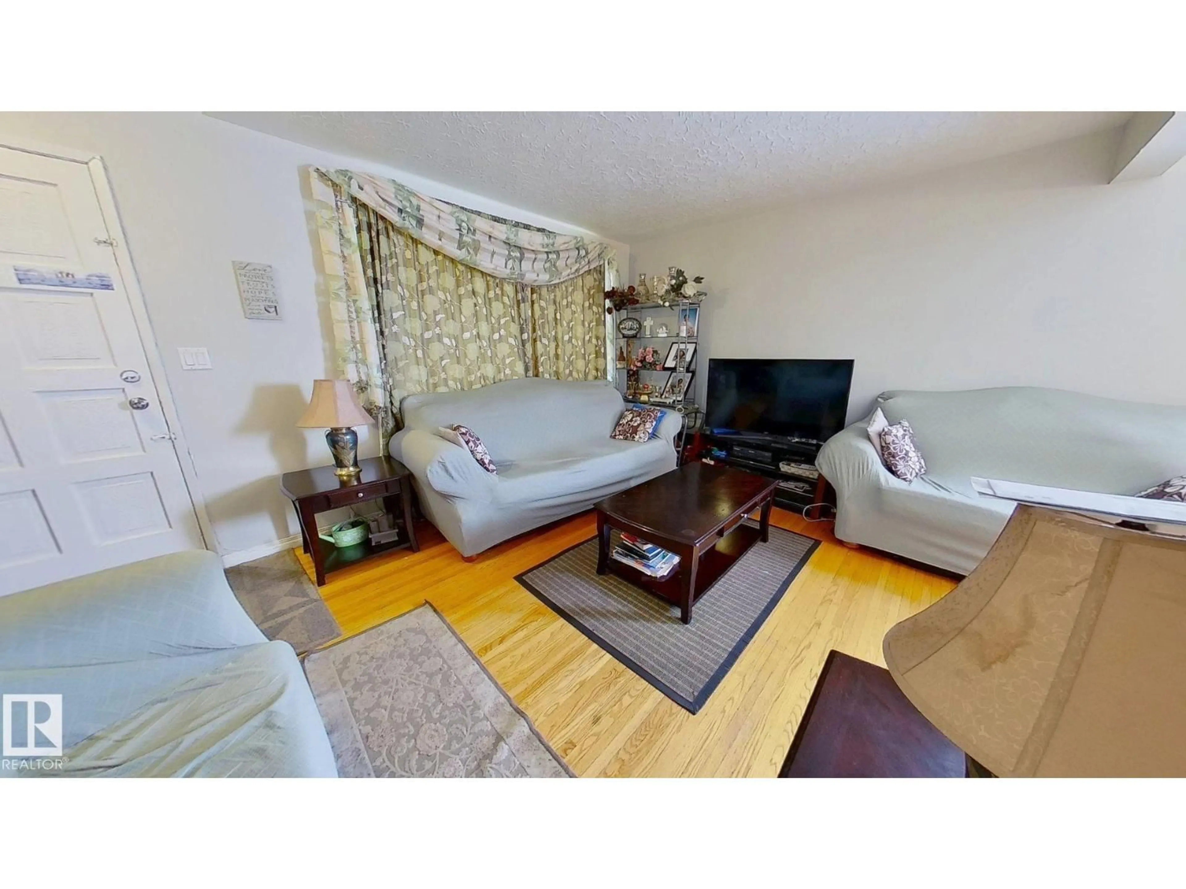 Living room with furniture, wood/laminate floor for 13320 139 ST, Edmonton Alberta T8R1J6