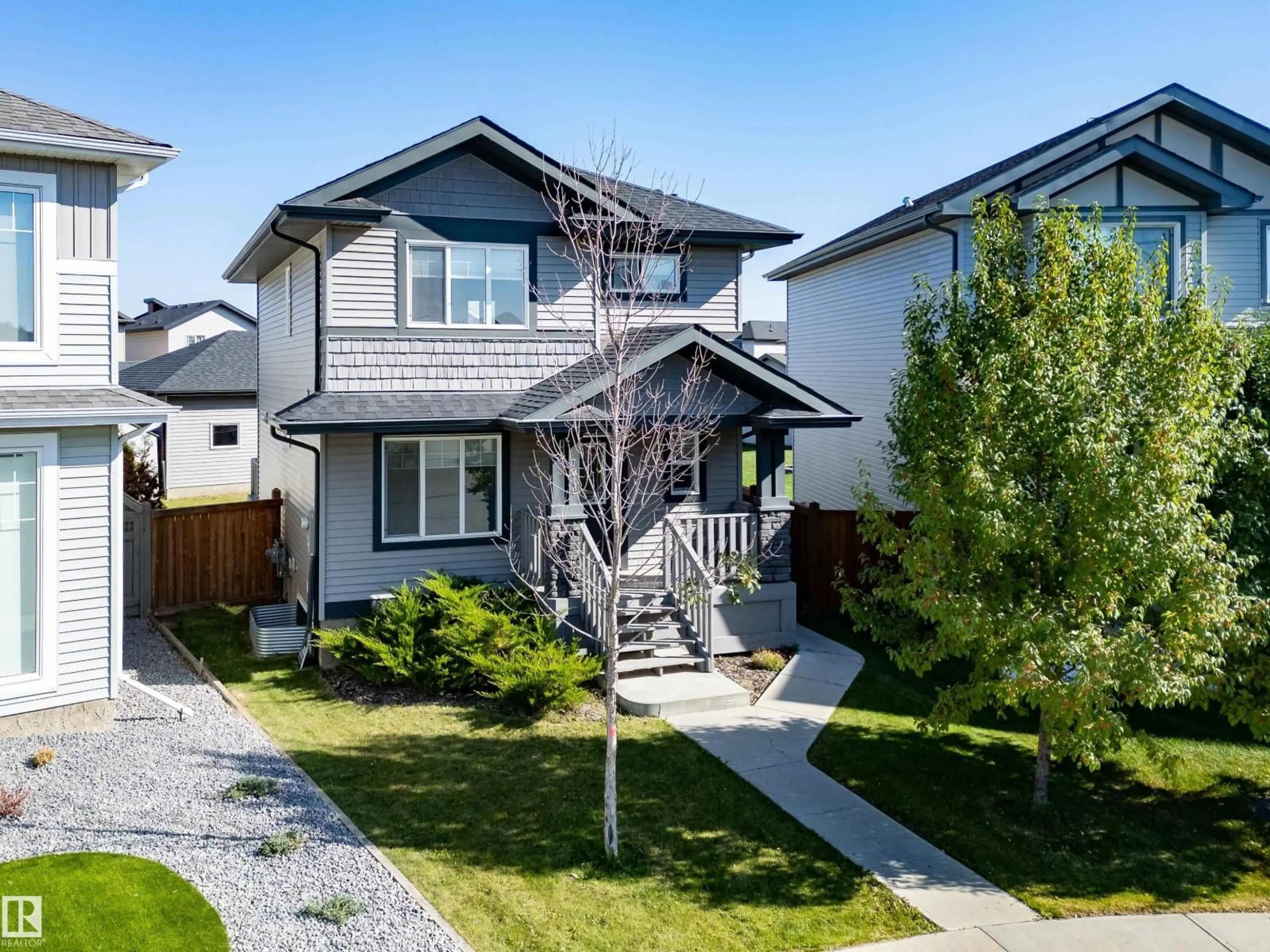Home with vinyl exterior material, street for 7210 CARDINAL WY, Edmonton Alberta T6W2Y5