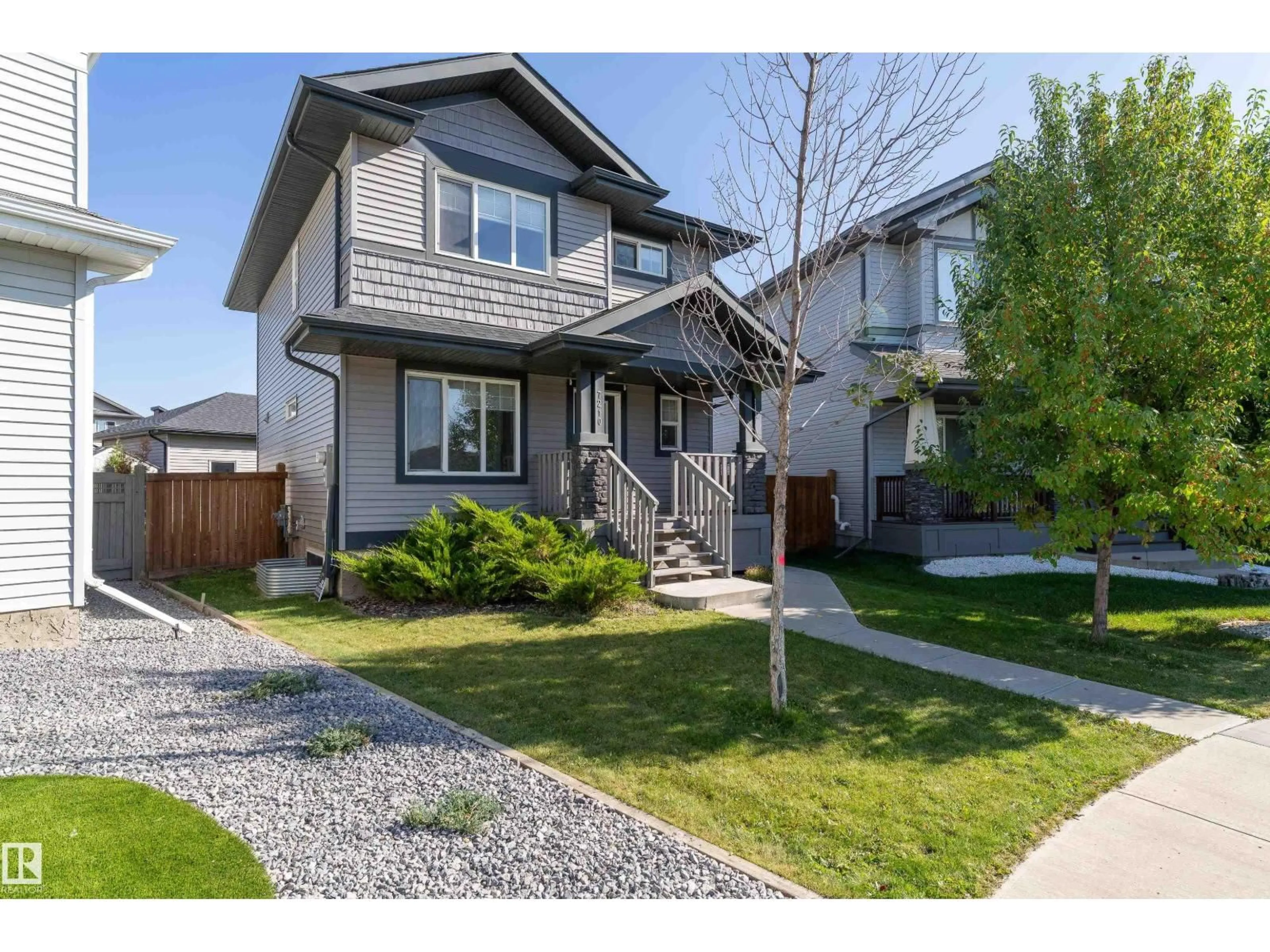 Home with vinyl exterior material, street for 7210 CARDINAL WY, Edmonton Alberta T6W2Y5