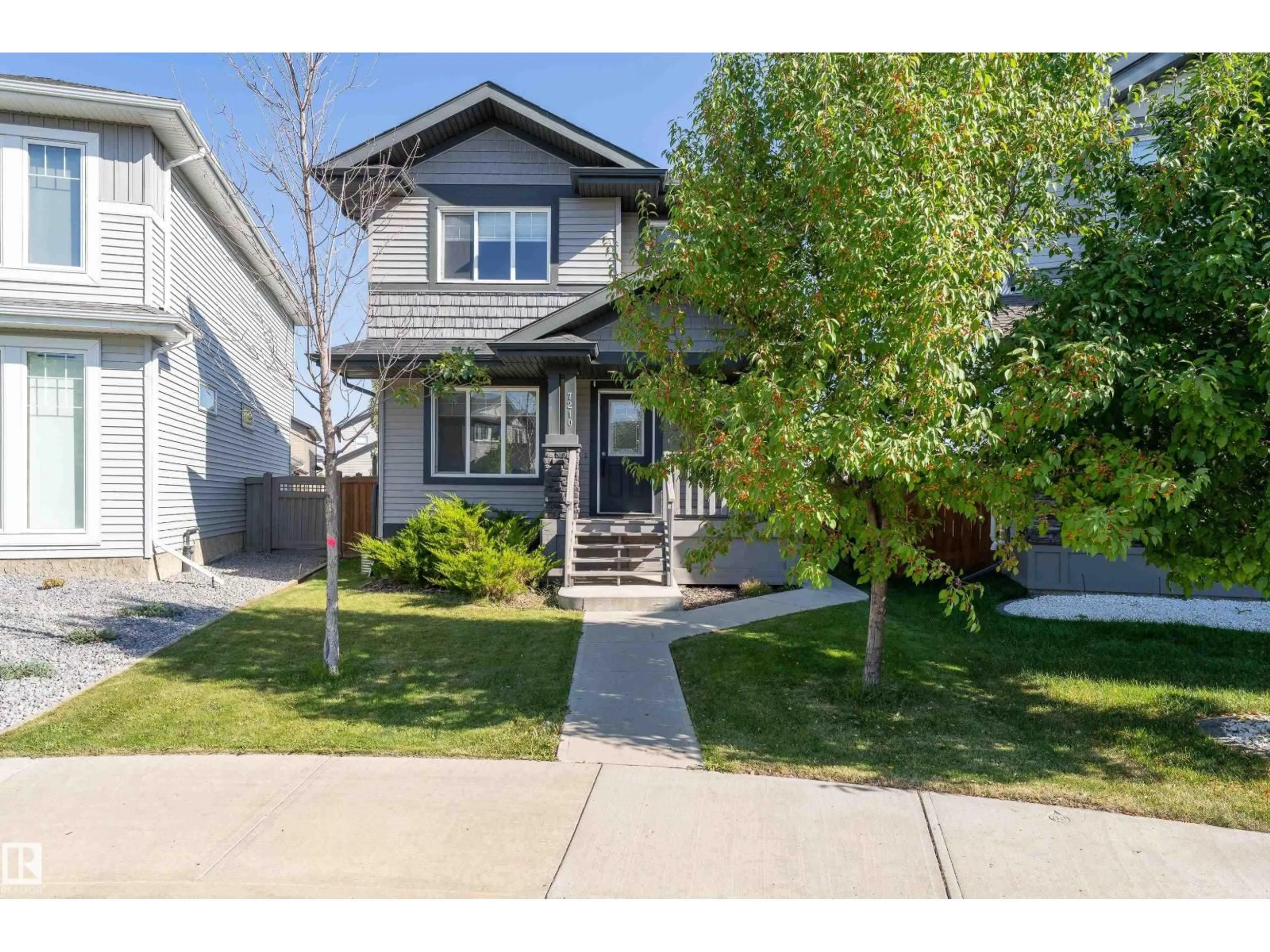 Home with vinyl exterior material, street for 7210 CARDINAL WY, Edmonton Alberta T6W2Y5