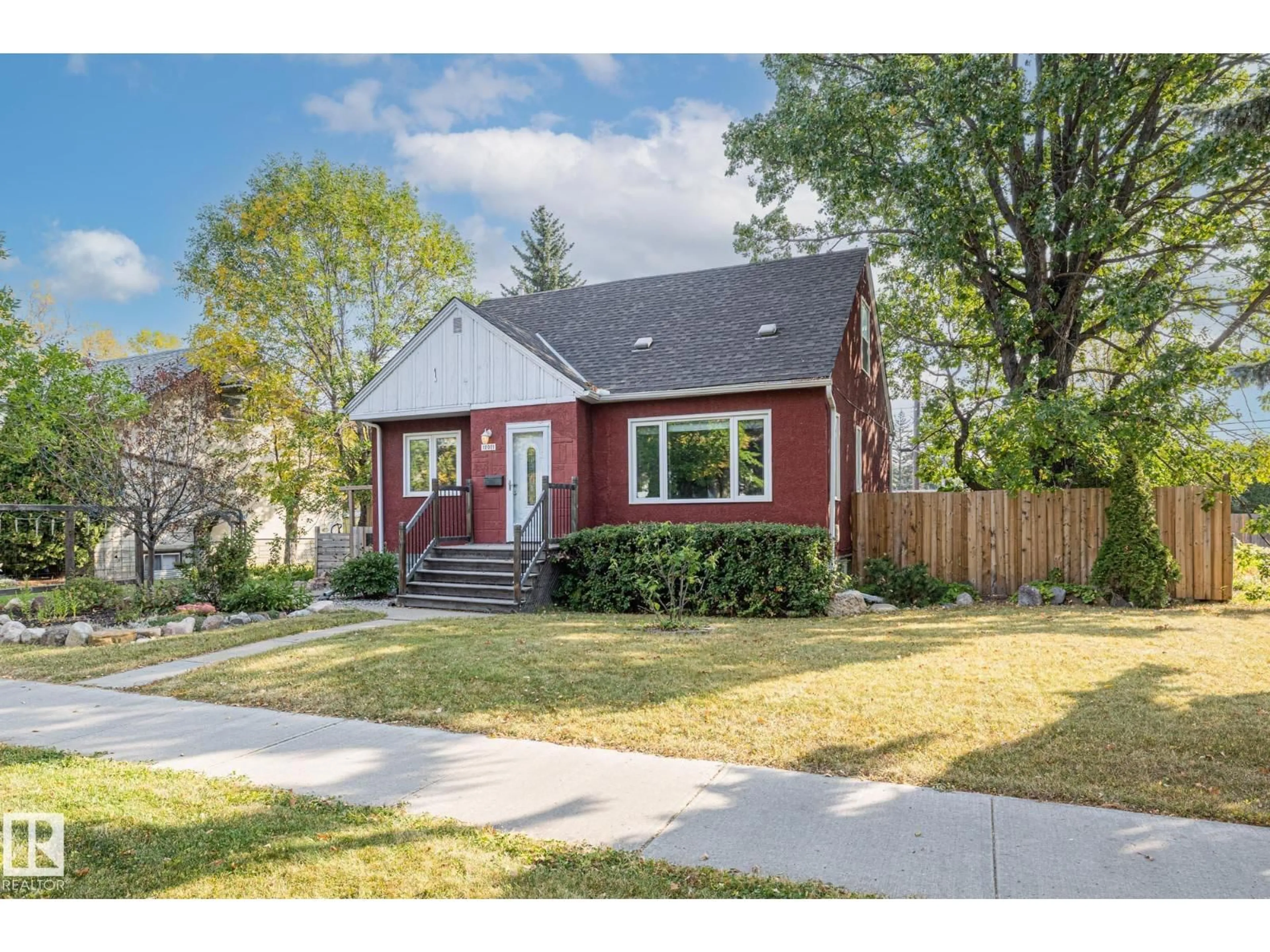 Home with brick exterior material, street for NW - 11011 135 ST, Edmonton Alberta T5M1K4