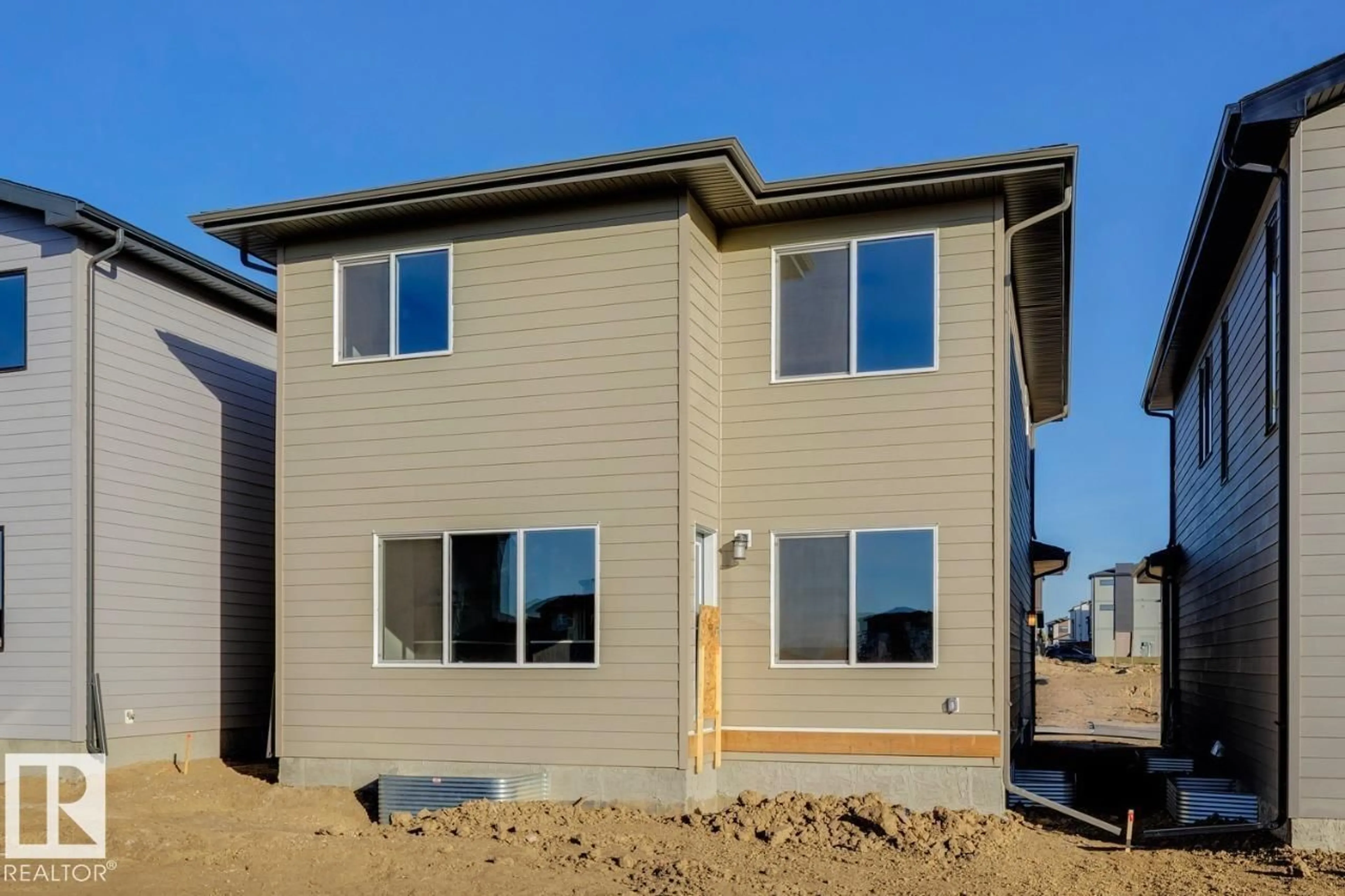 Home with vinyl exterior material, street for 7608 KIMIWAN CR, Edmonton Alberta T6W5N6