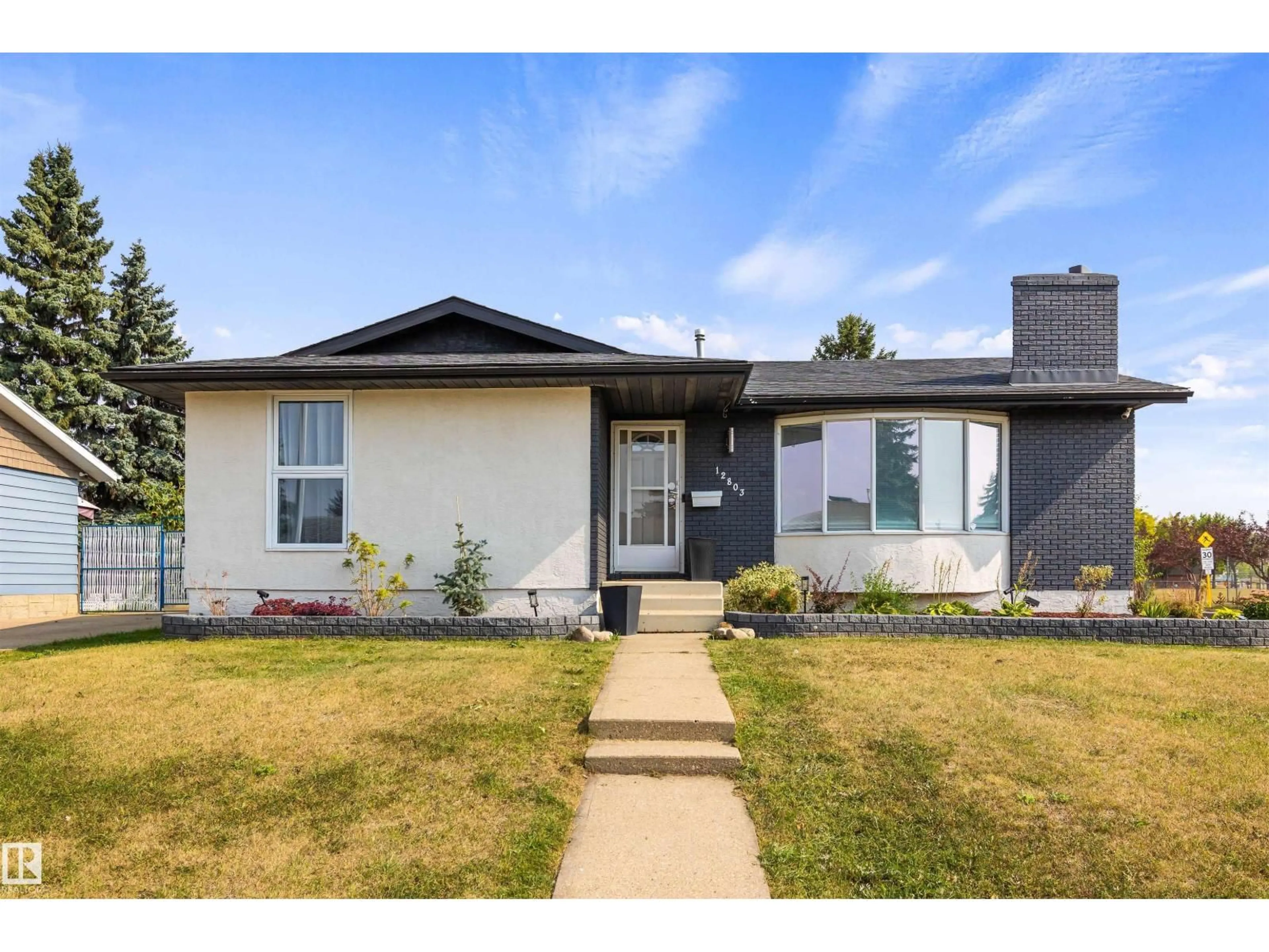 Home with vinyl exterior material, street for NW - 12803 47 ST, Edmonton Alberta T5A2J8