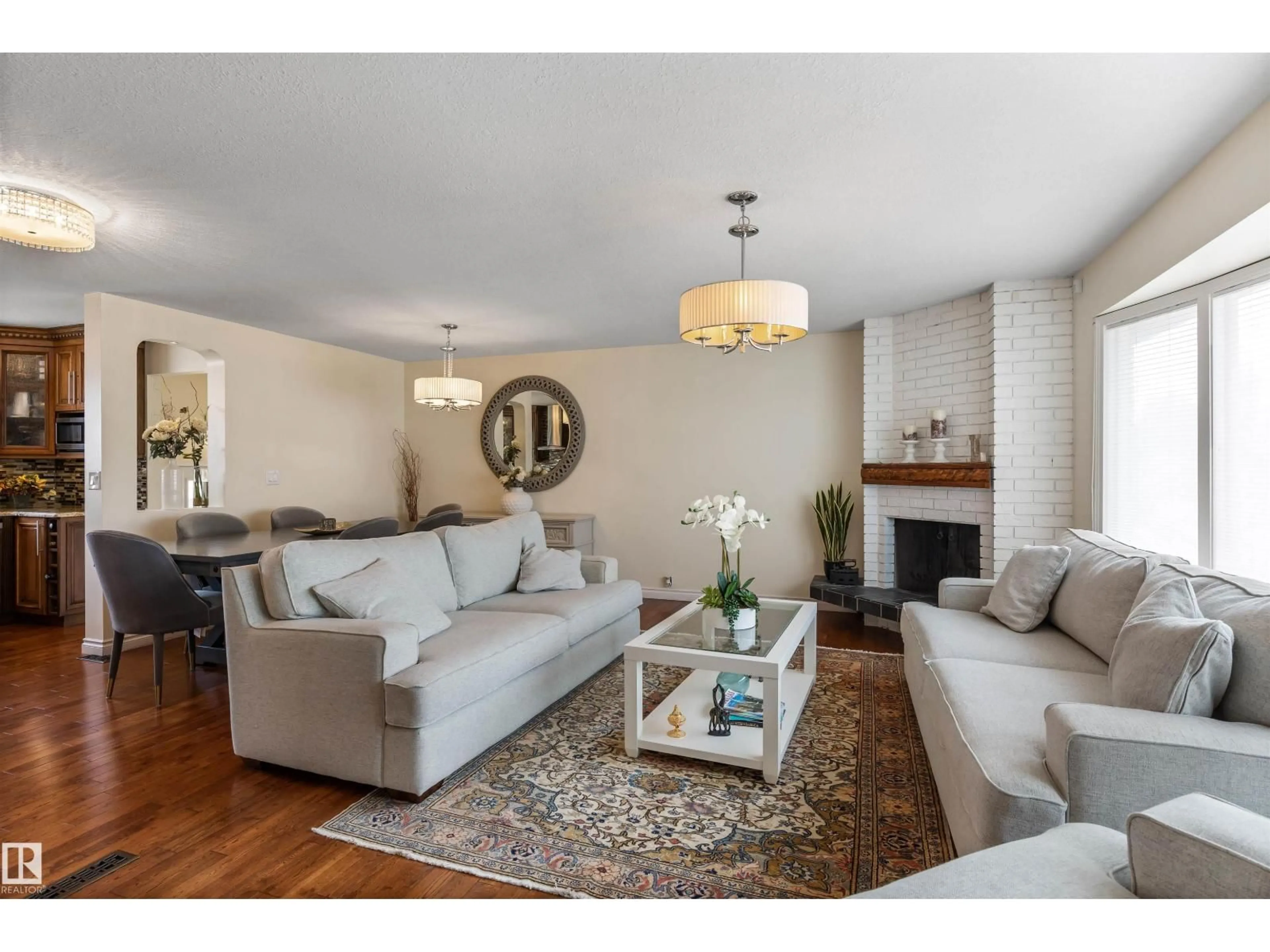 Living room with furniture, wood/laminate floor for NW - 12803 47 ST, Edmonton Alberta T5A2J8