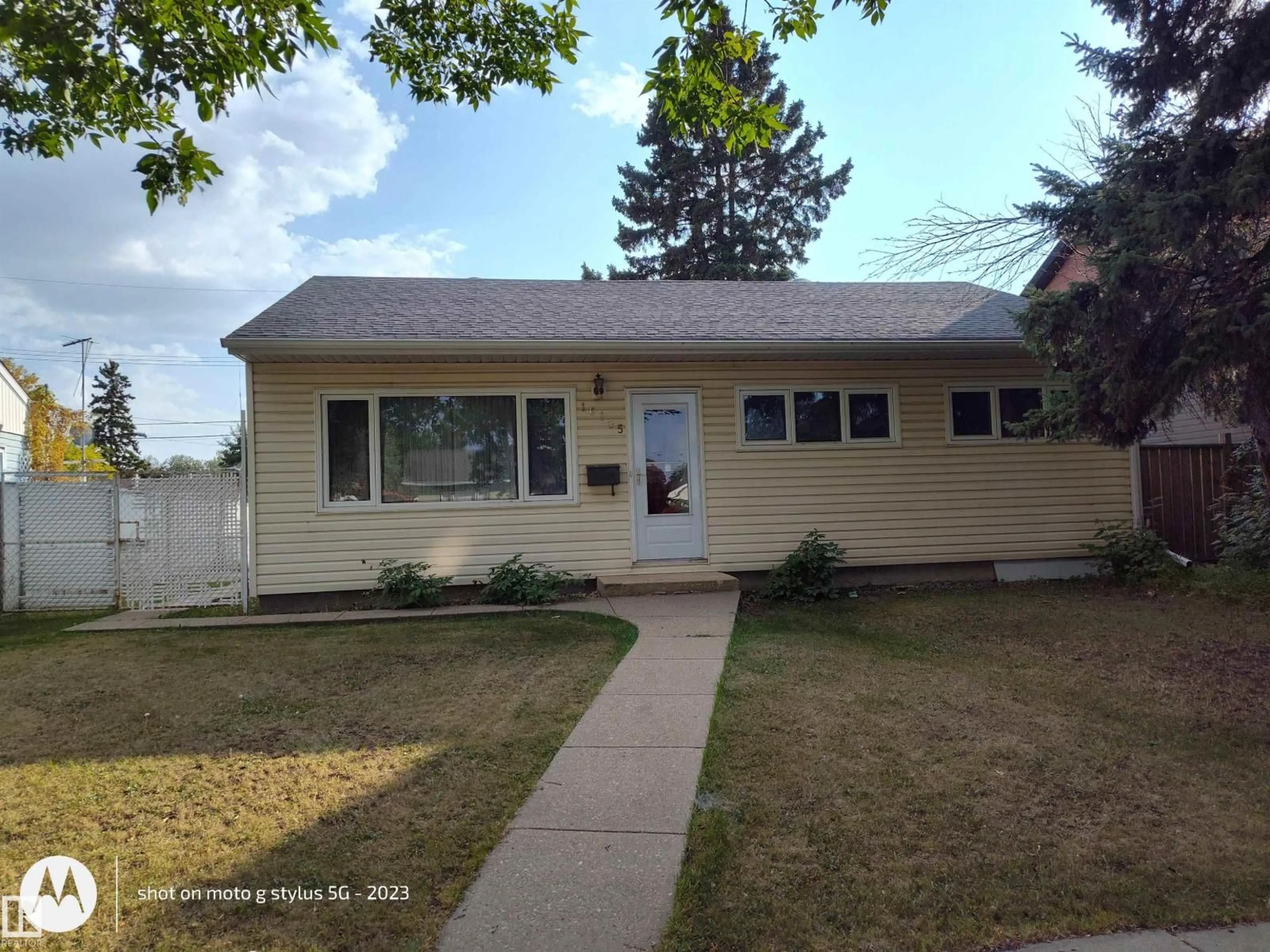 Home with vinyl exterior material, street for 16165 109 AV NW, Edmonton Alberta T5P4E5