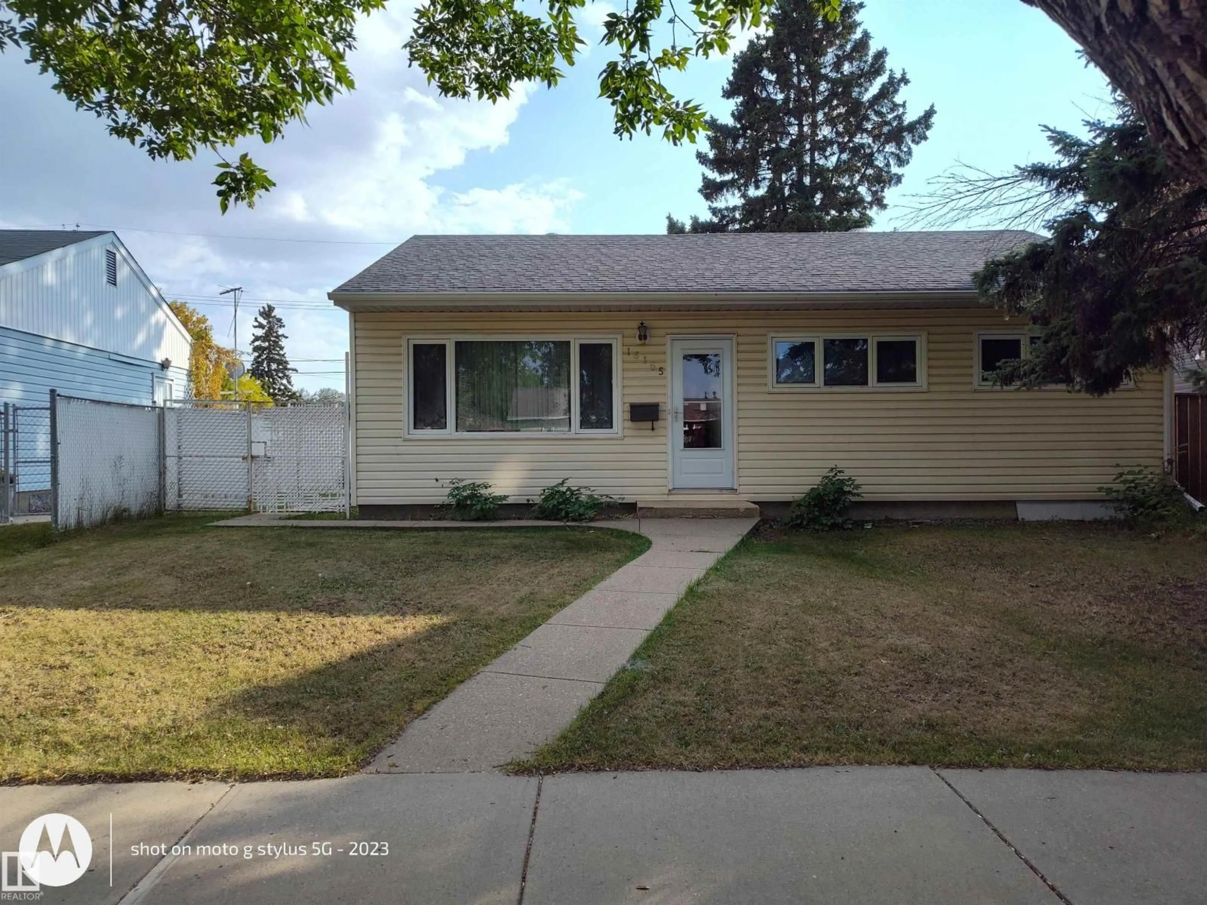 Home with vinyl exterior material, street for 16165 109 AV NW, Edmonton Alberta T5P4E5