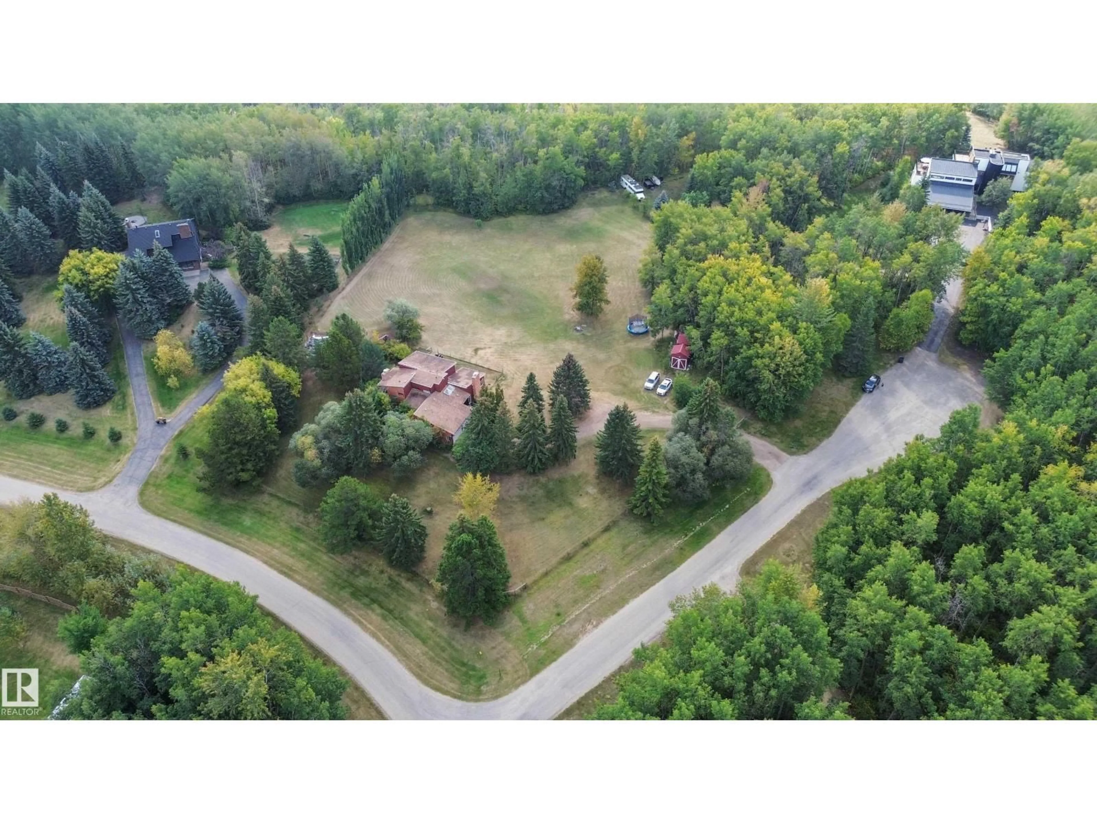 A pic from outside/outdoor area/front of a property/back of a property/a pic from drone, forest/trees view for 26123 - 29 TWP RD 511 RD, Rural Parkland County Alberta T7Y1B9