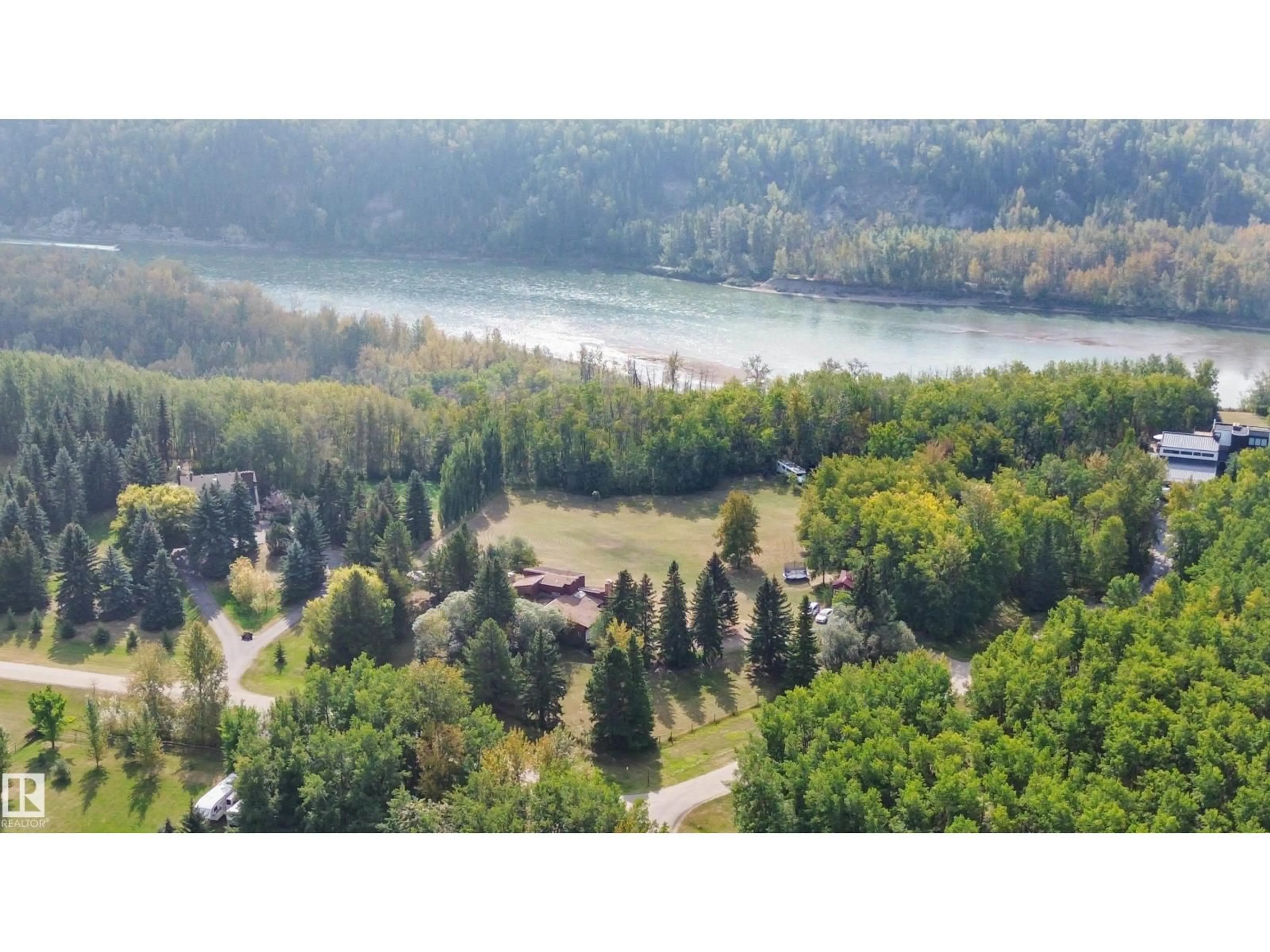 A pic from outside/outdoor area/front of a property/back of a property/a pic from drone, water/lake/river/ocean view for 26123 - 29 TWP RD 511 RD, Rural Parkland County Alberta T7Y1B9