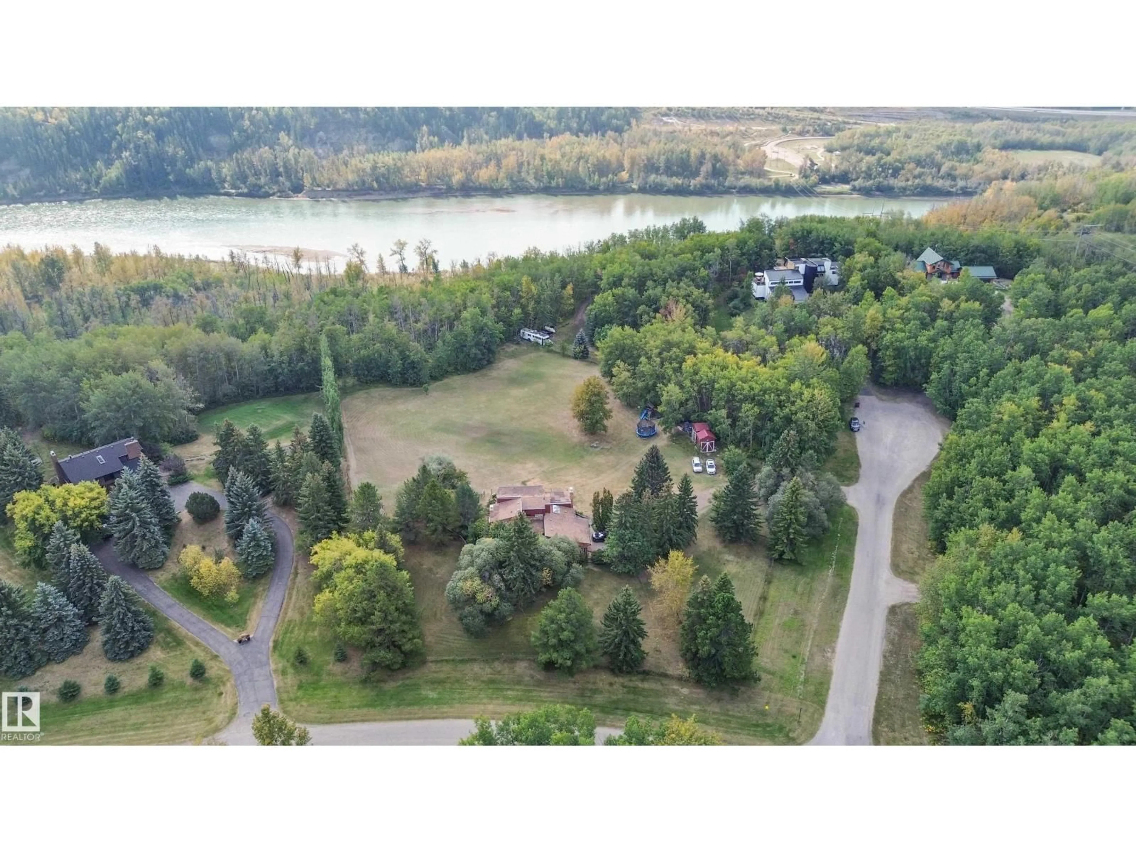 A pic from outside/outdoor area/front of a property/back of a property/a pic from drone, water/lake/river/ocean view for 26123 - 29 TWP RD 511 RD, Rural Parkland County Alberta T7Y1B9