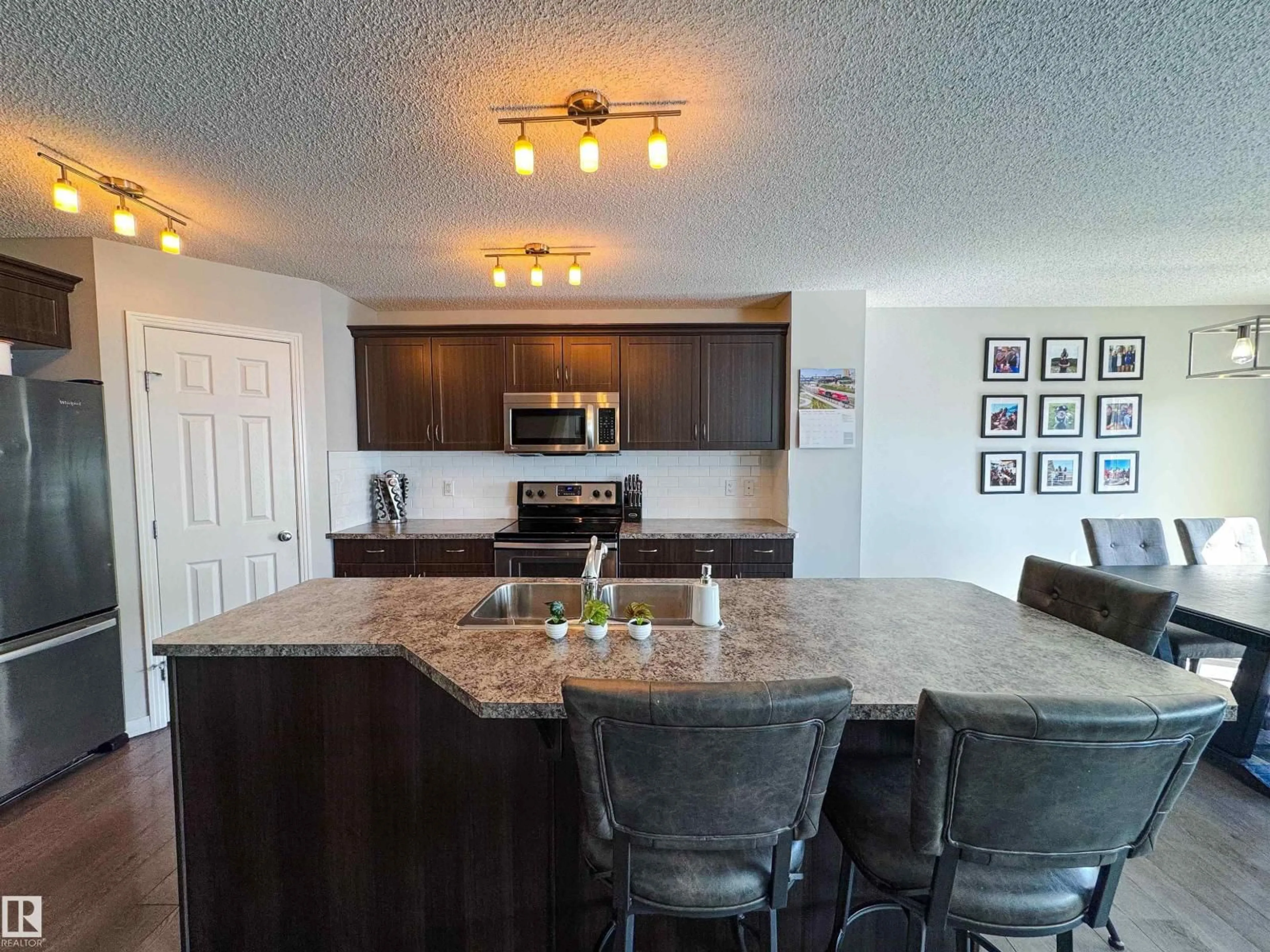 Open concept kitchen, ceramic/tile floor for 445 REED CR, Leduc Alberta T9E0R5