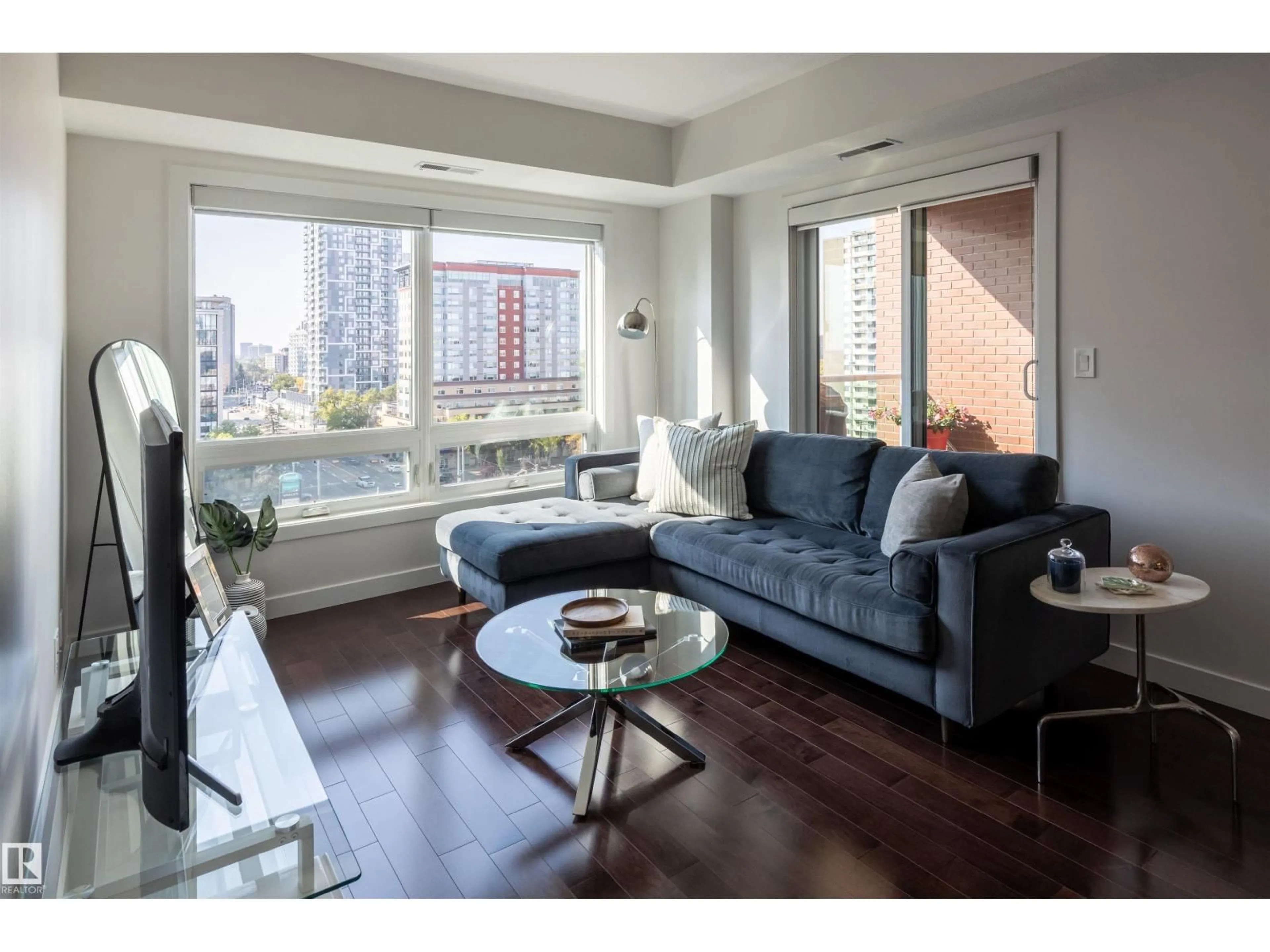 Living room with furniture, wood/laminate floor for 905 - 10055 118 ST, Edmonton Alberta T5K0C1