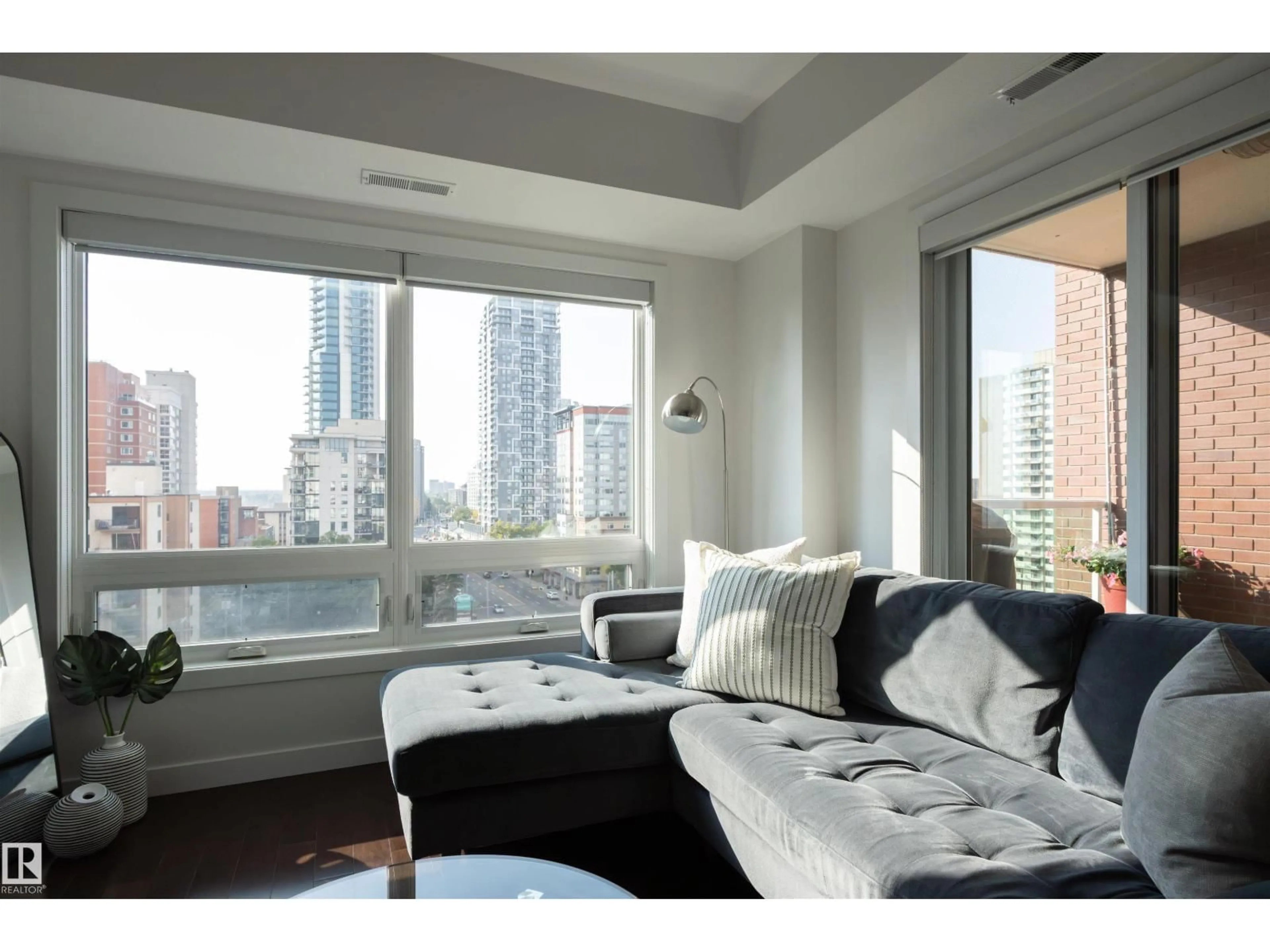 Living room with furniture, wood/laminate floor for 905 - 10055 118 ST, Edmonton Alberta T5K0C1