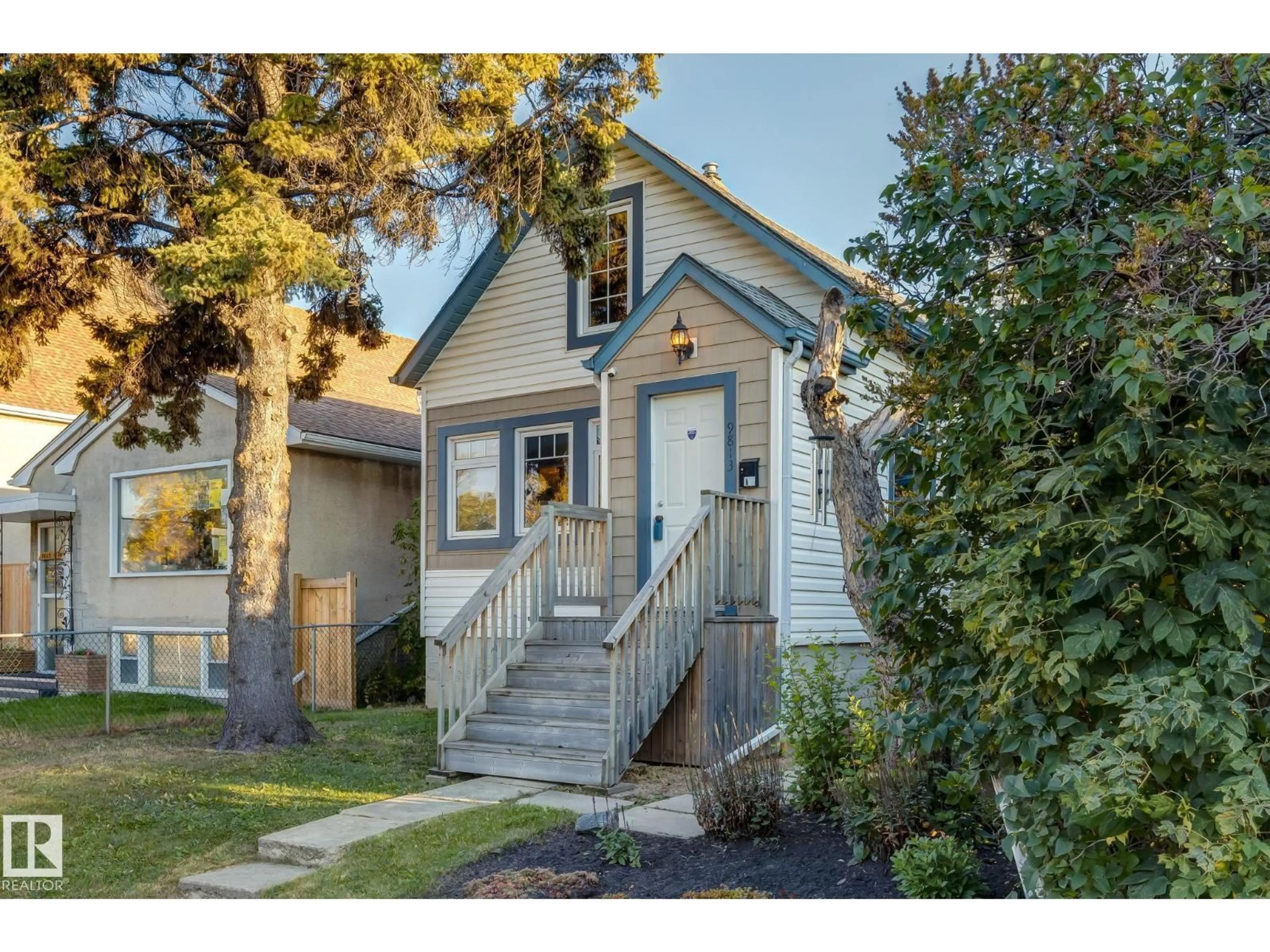 Home with vinyl exterior material, street for 9813 76 AV, Edmonton Alberta T6E1K6