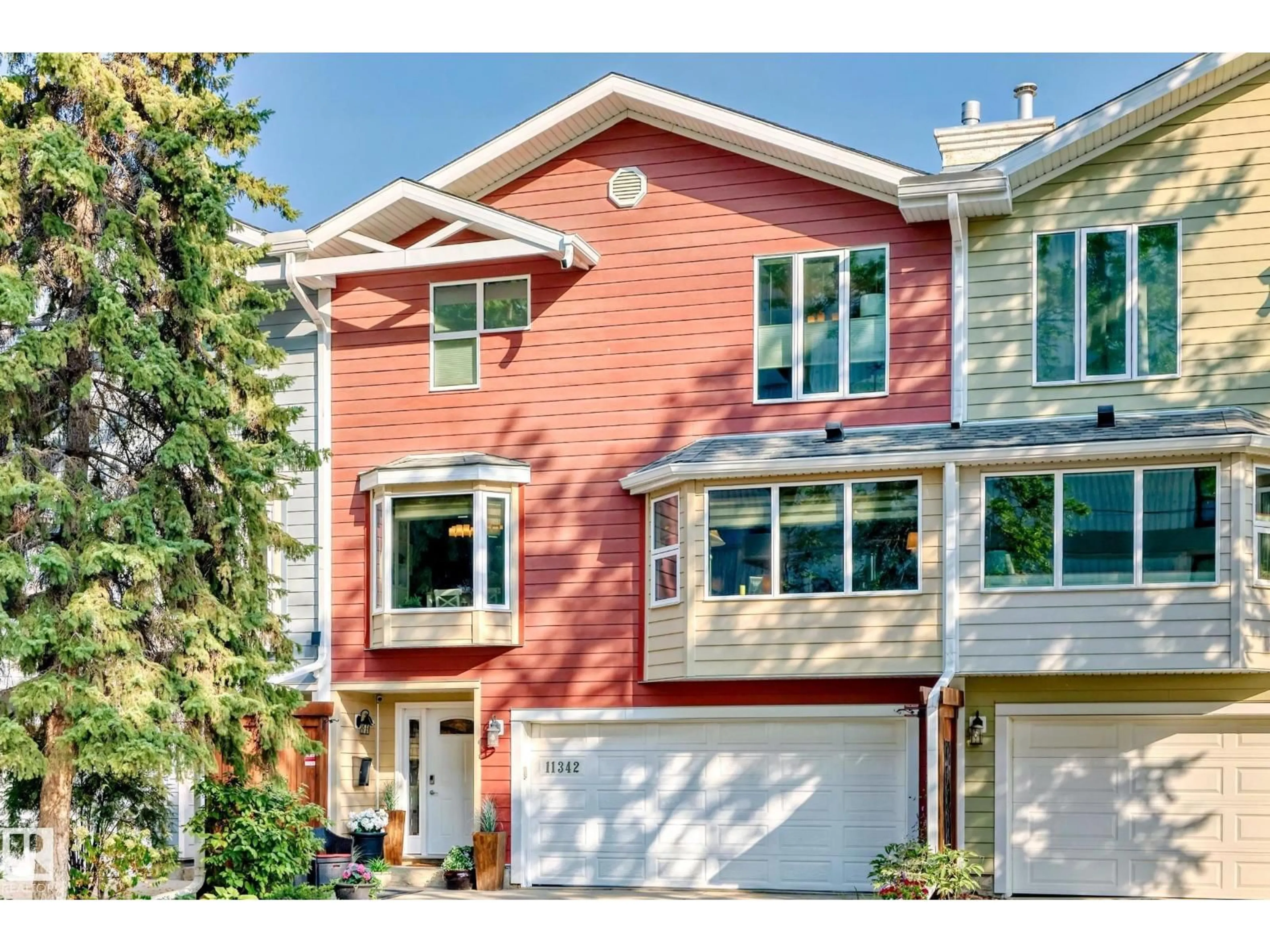 Home with vinyl exterior material, street for 11342 102 AV, Edmonton Alberta T5K0P7